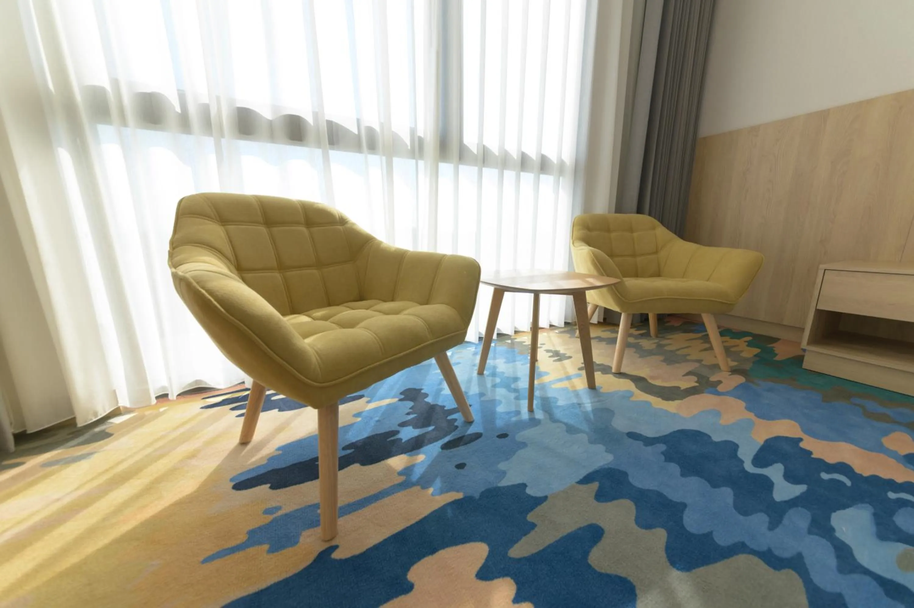 Seating area in JANDA Golden Tulip Hotel