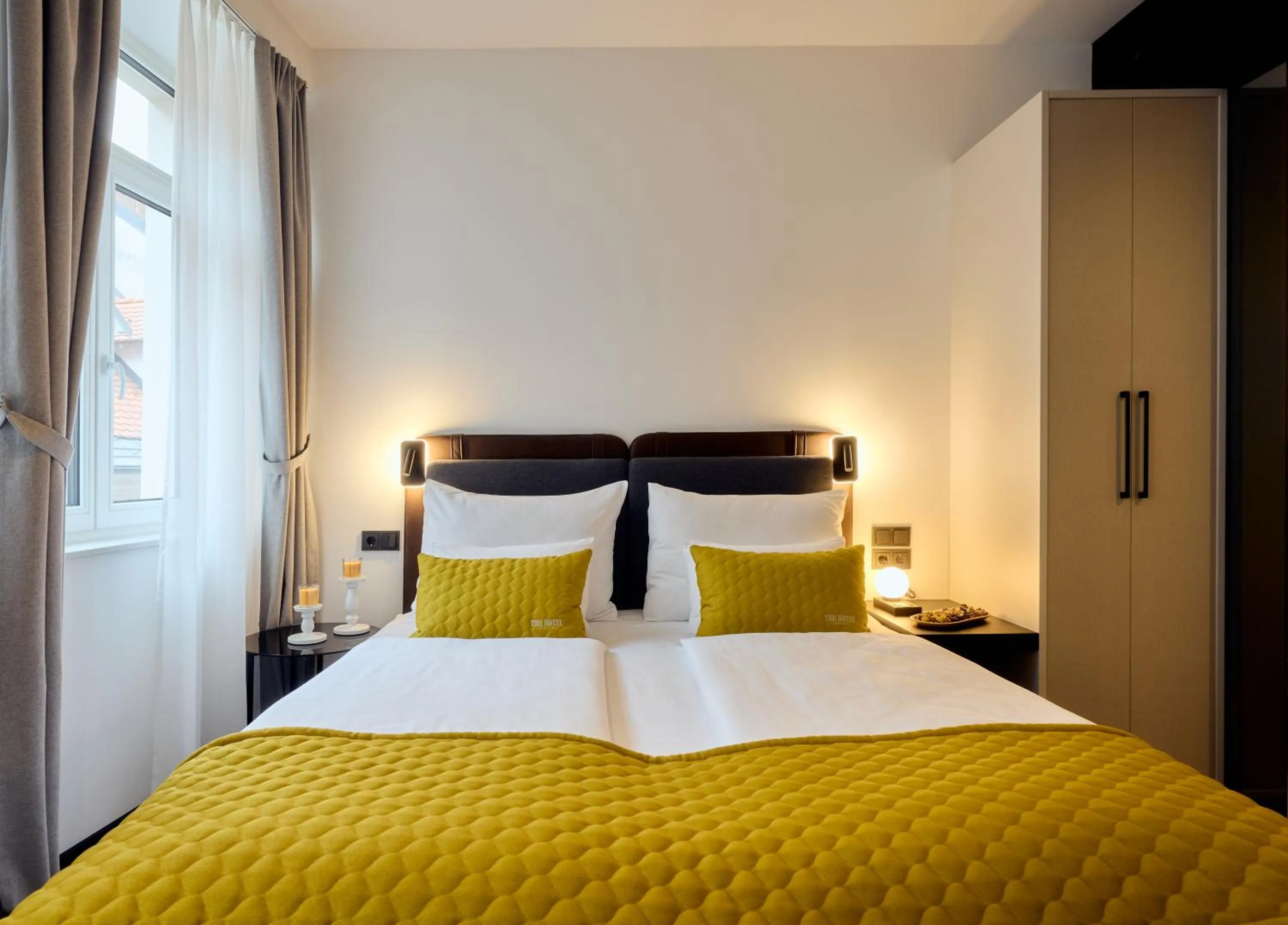 Bed in The Hotel Ljubljana