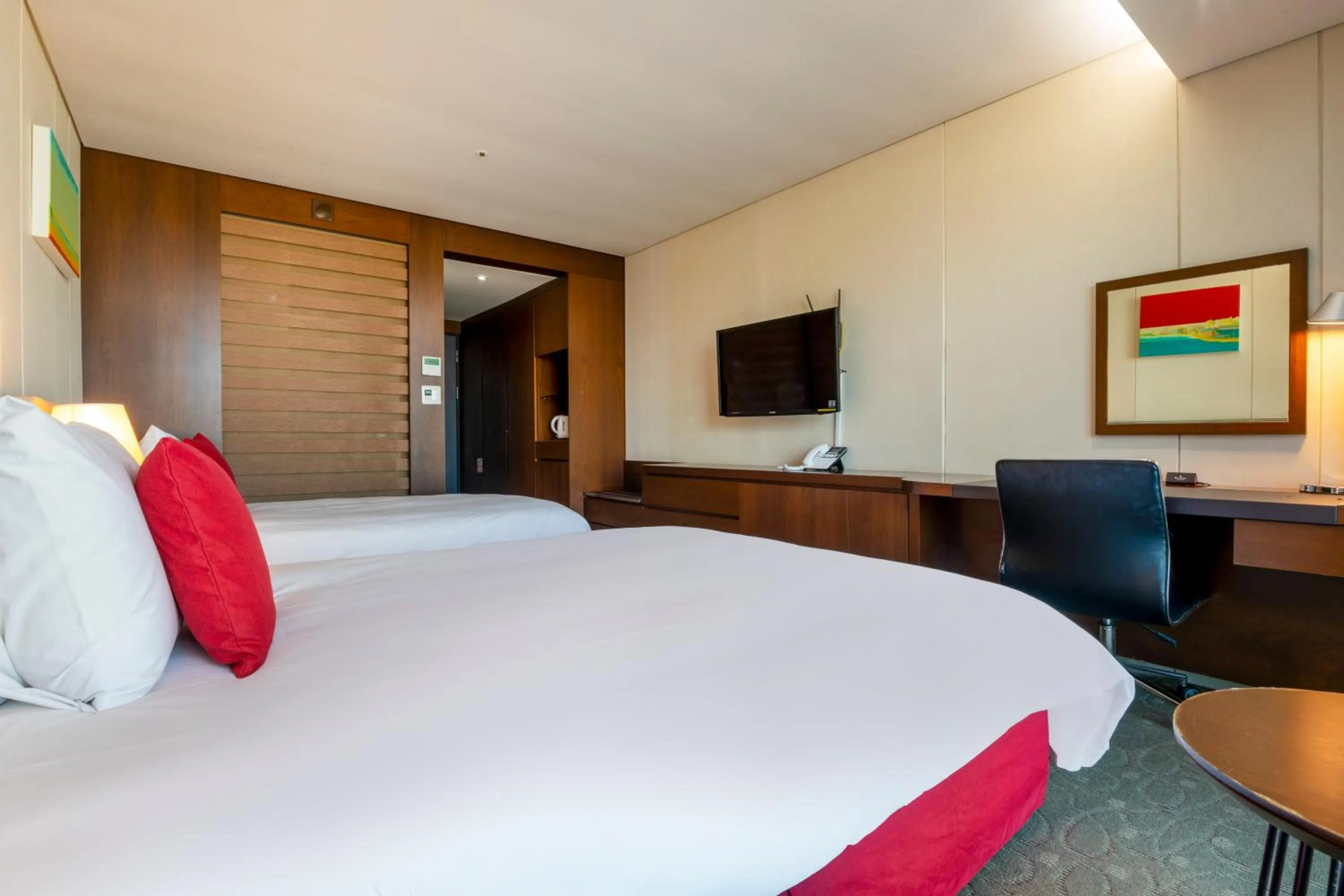 Bed in Ramada by Wyndham Jeju Hamdeok