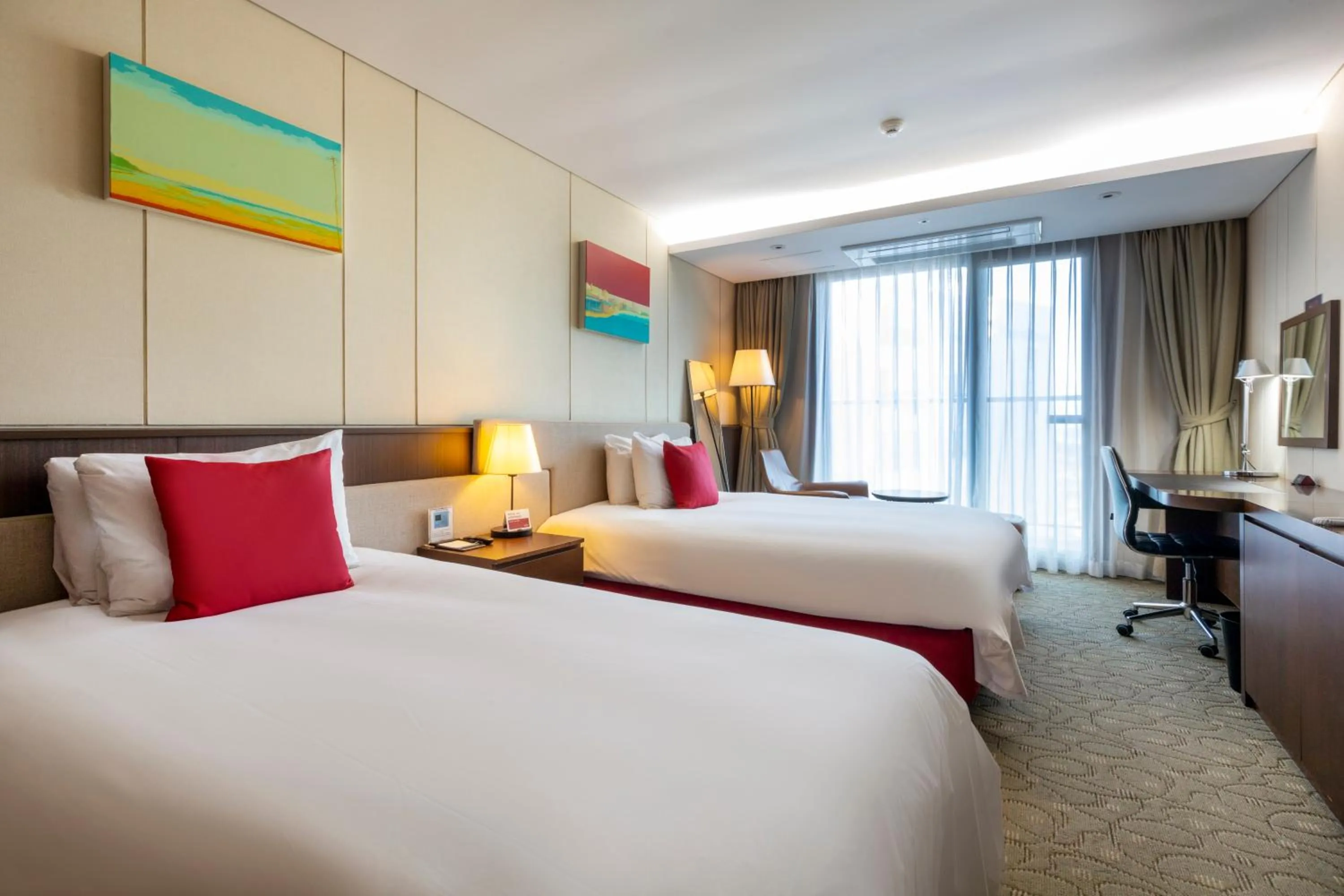 Bed in Ramada by Wyndham Jeju Hamdeok