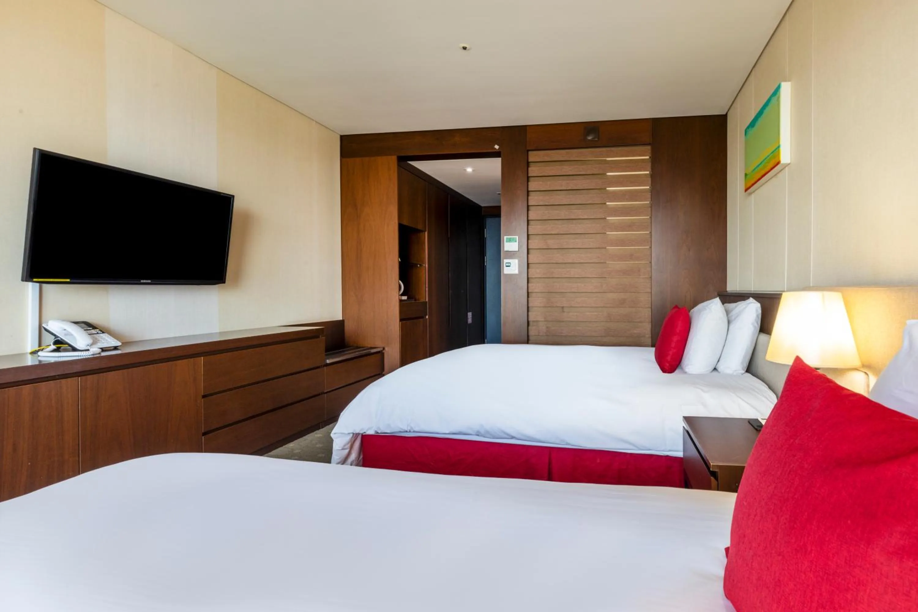 Bed in Ramada by Wyndham Jeju Hamdeok