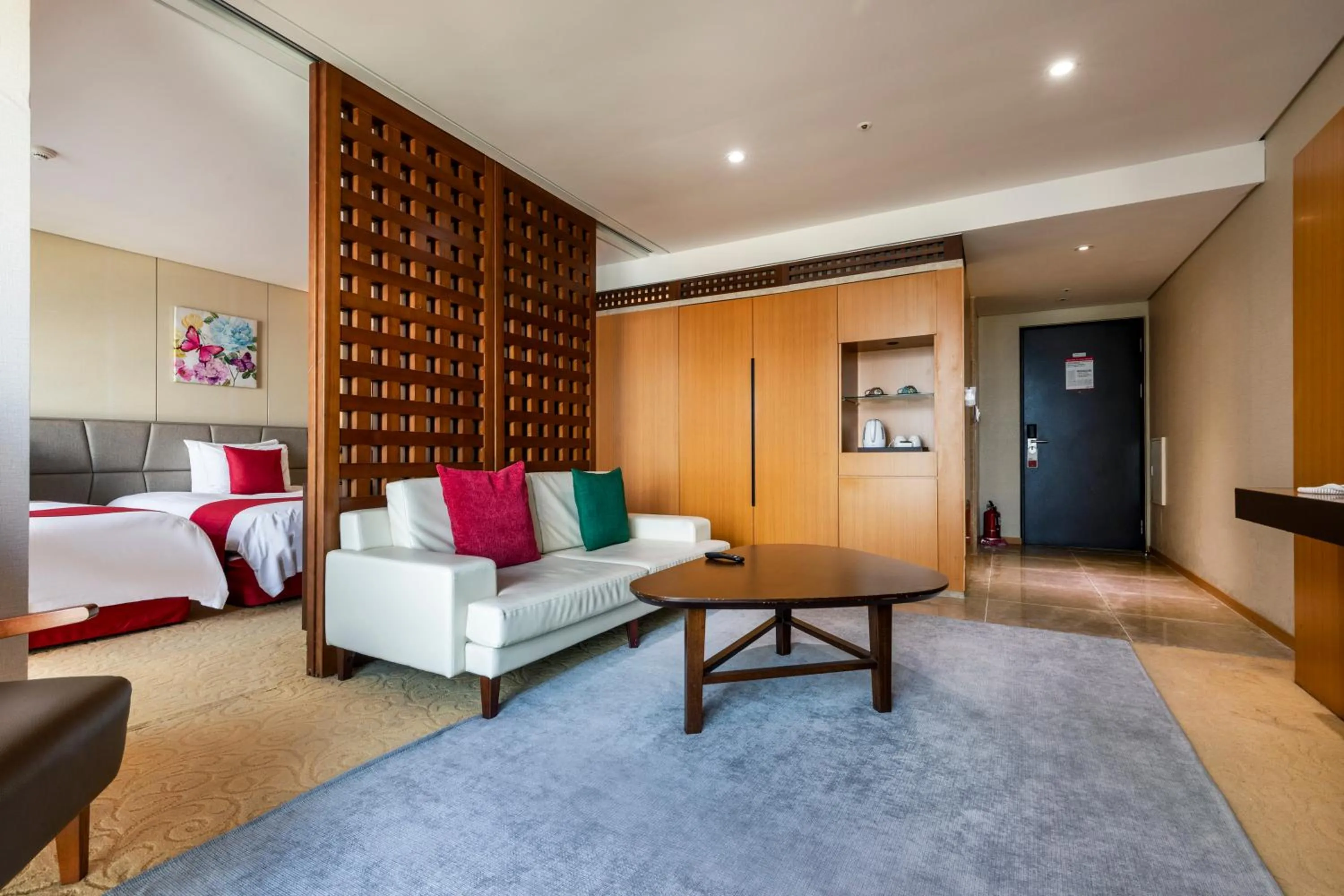 Bed in Ramada by Wyndham Jeju Hamdeok