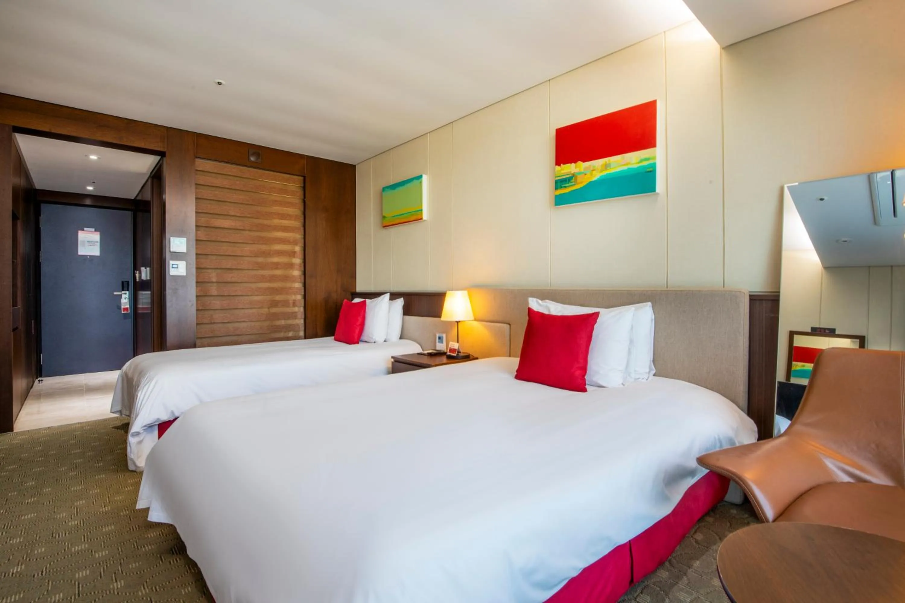 Bed in Ramada by Wyndham Jeju Hamdeok