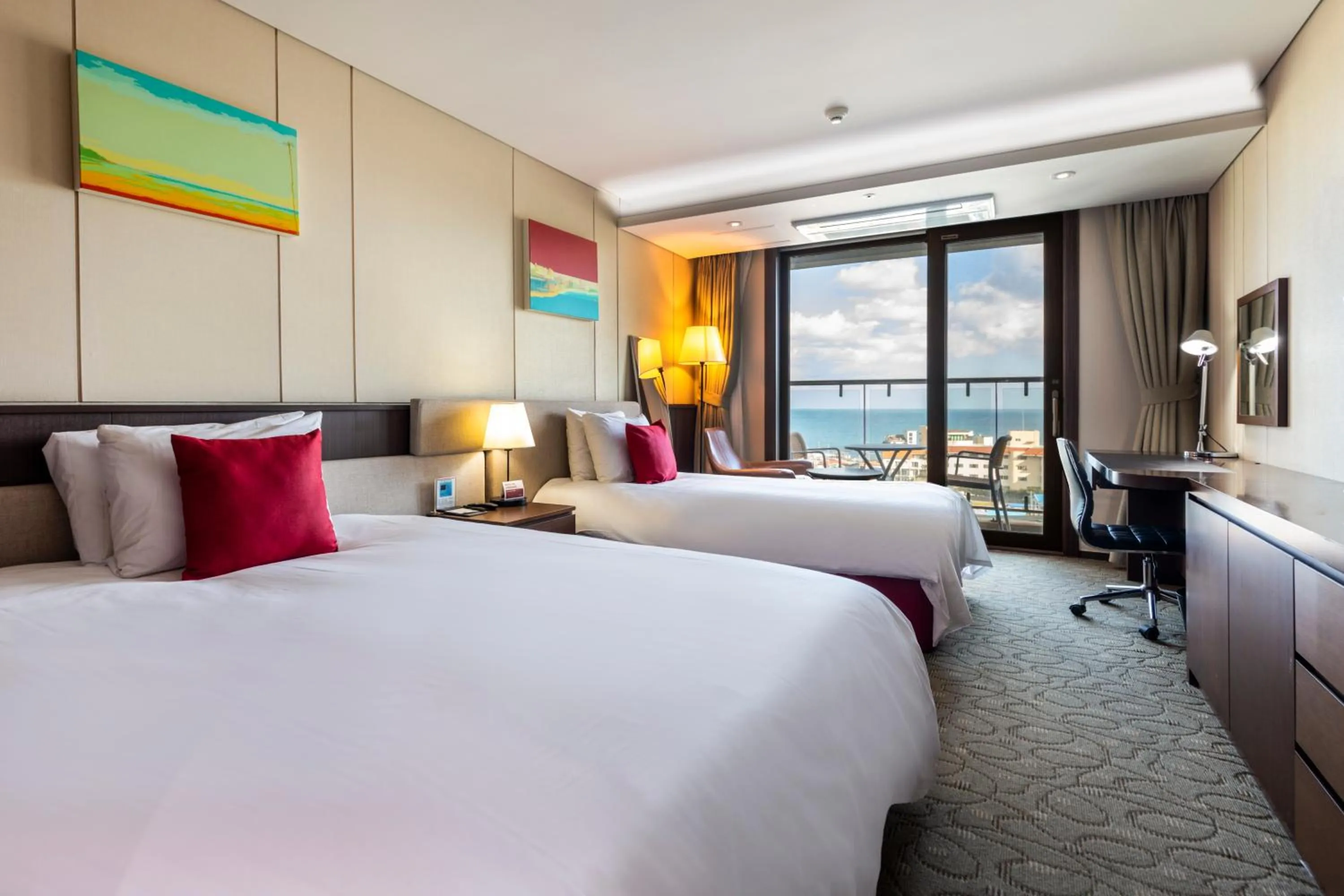 Bed in Ramada by Wyndham Jeju Hamdeok