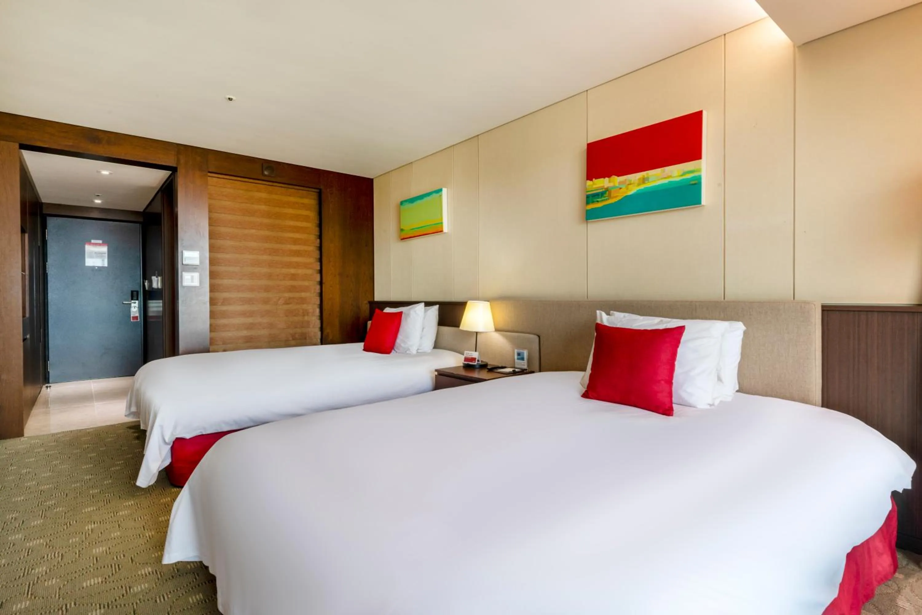 Bed in Ramada by Wyndham Jeju Hamdeok