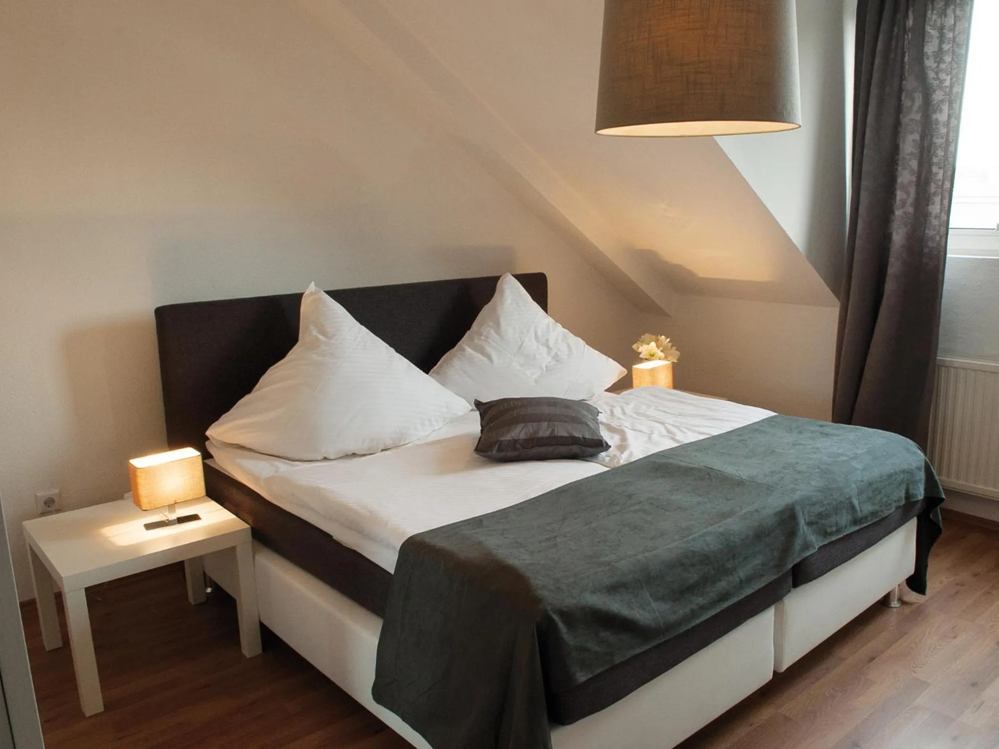 Bed in Hotel Garni Zum Dorfbrunnen