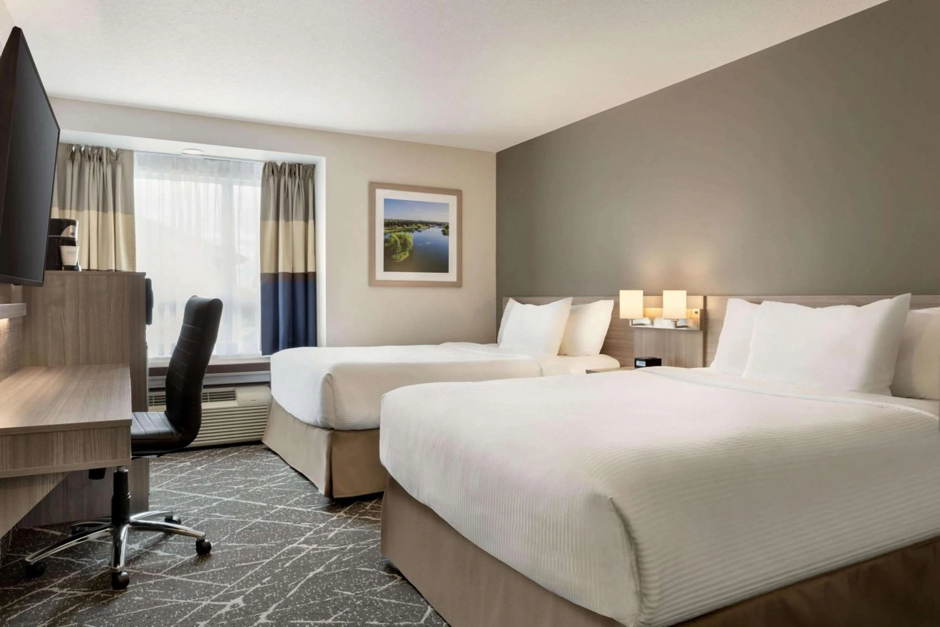 Photo of the whole room, Bed in Microtel Inn & Suites by Wyndham Lloydminster