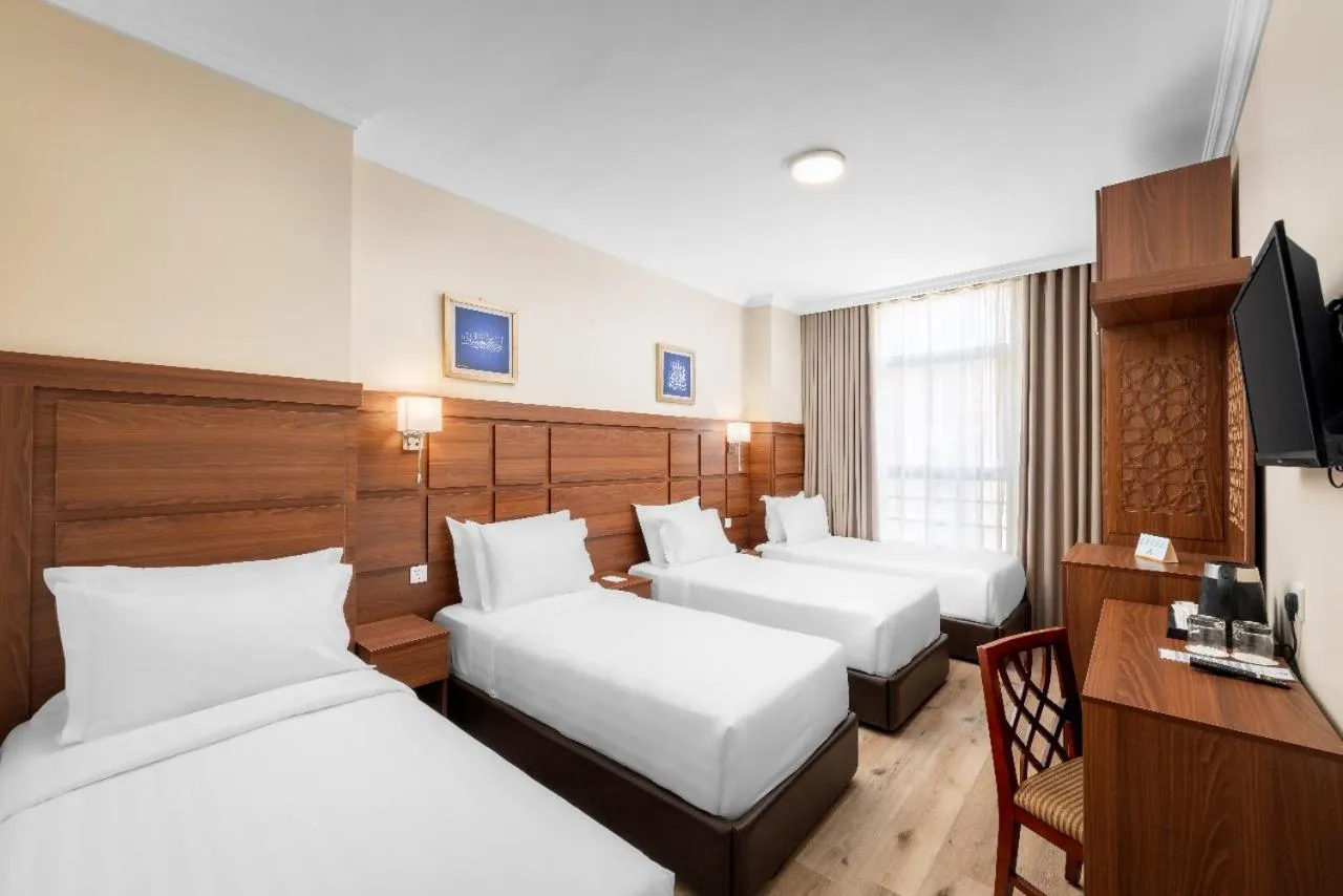 Bed in Deyar Al Eiman Hotel