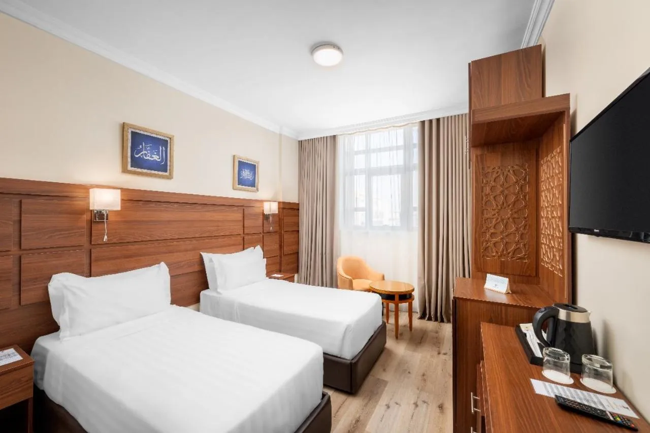 Bed in Deyar Al Eiman Hotel