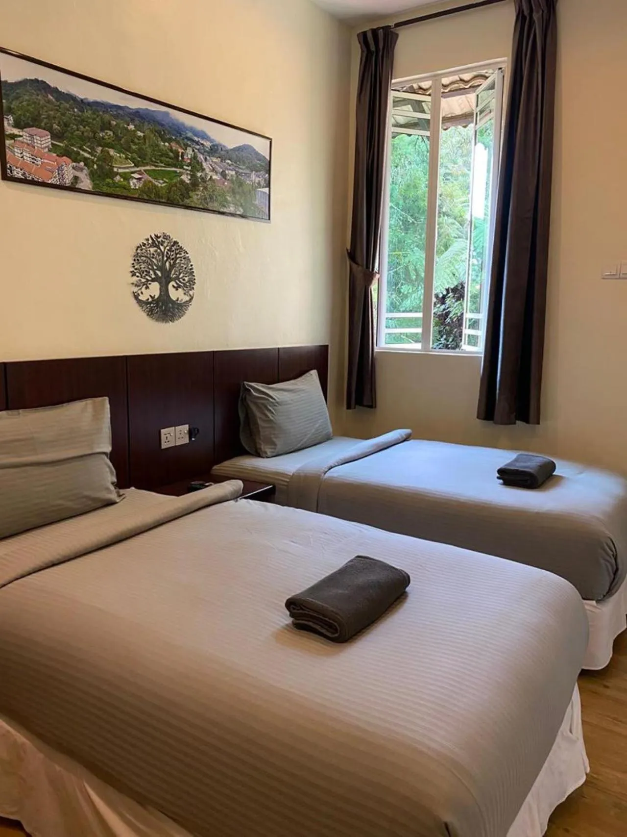 Bed in Highlanders Garden Guesthouse at Arundina Cameron Highlands