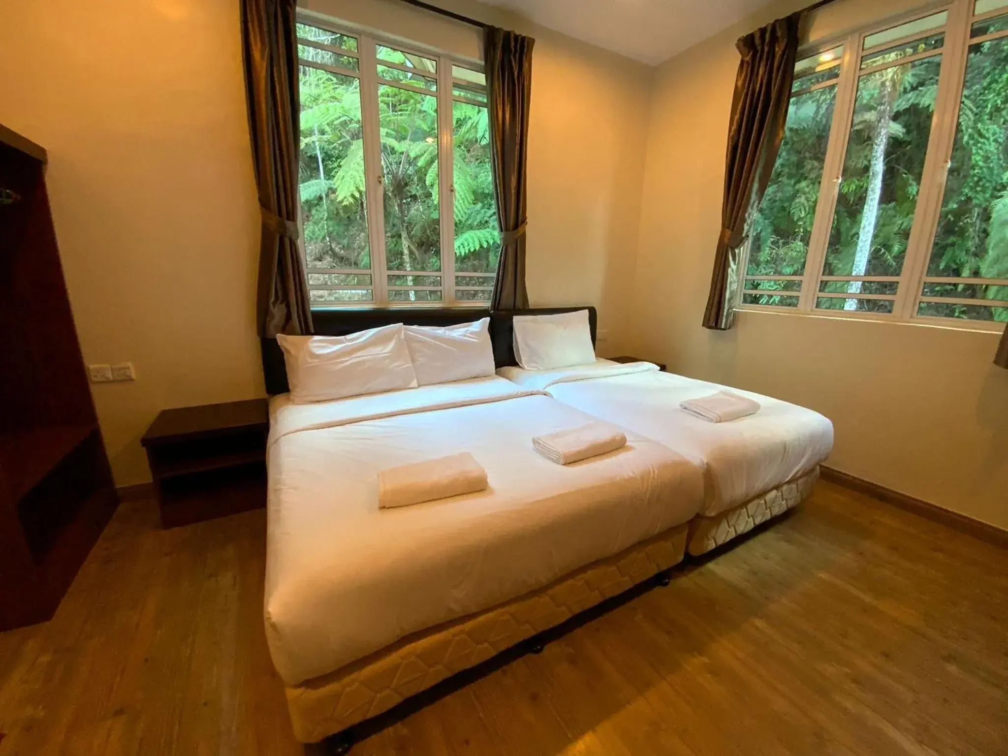 Bed in Highlanders Garden Guesthouse at Arundina Cameron Highlands Bed in Highlanders Garden Guesthouse at Arundina Cameron Highlands