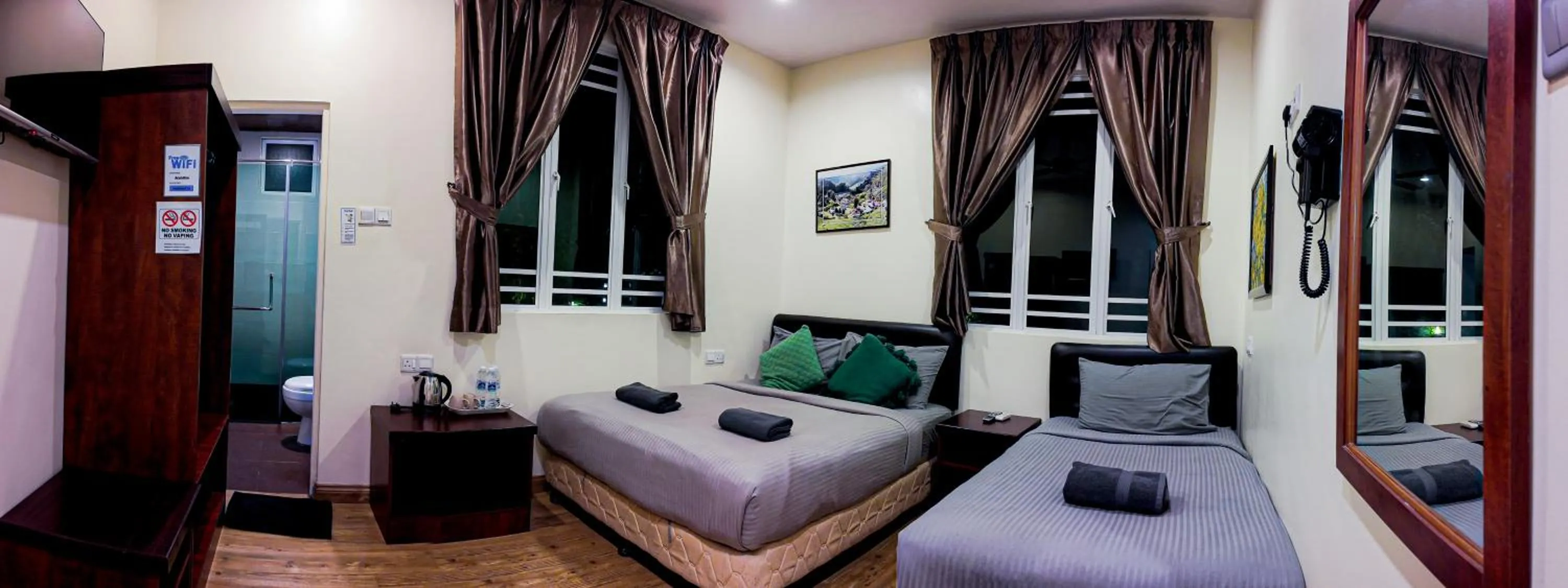 Bed in Highlanders Garden Guesthouse at Arundina Cameron Highlands