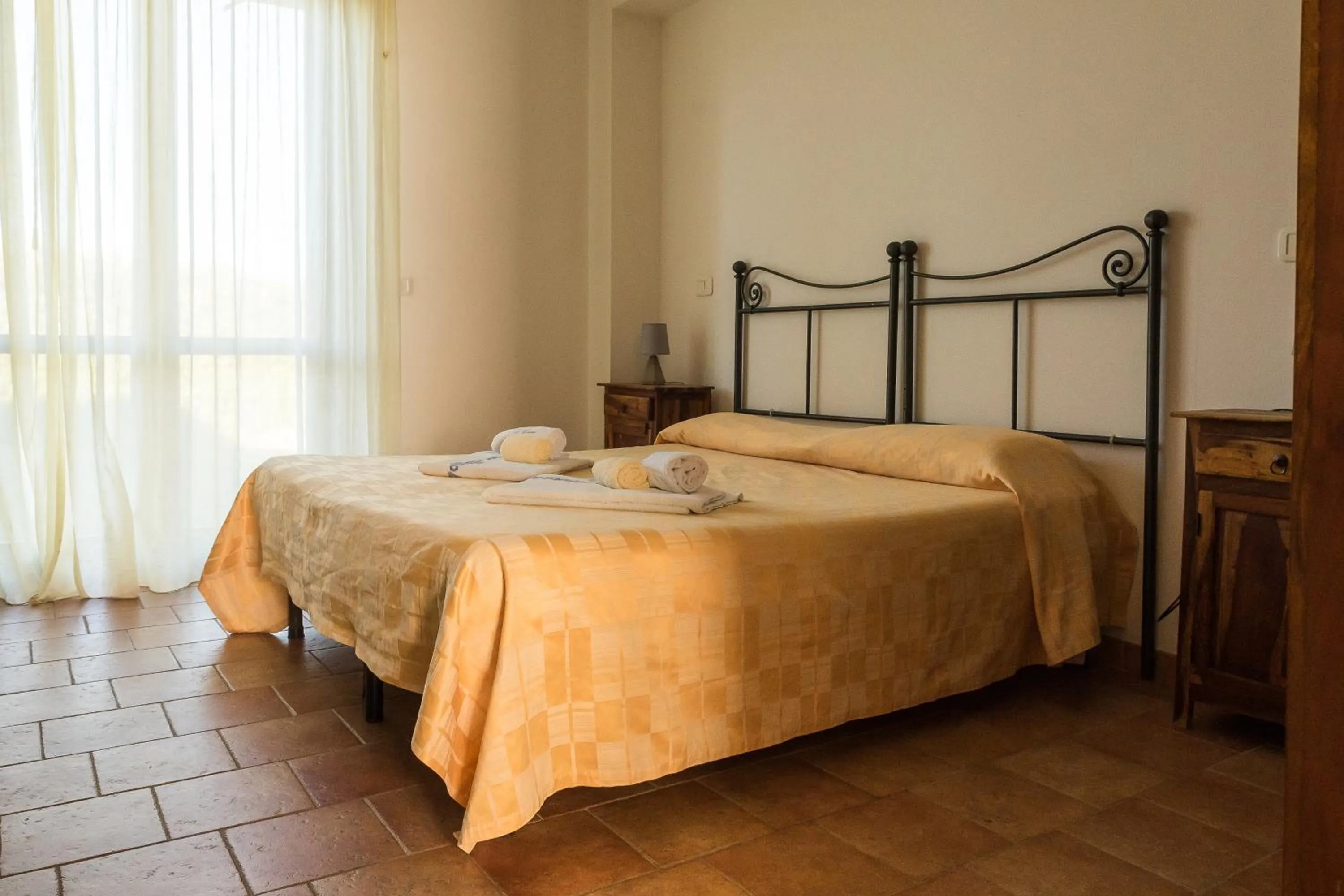 Photo of the whole room, Bed in Villaggio Le Querce