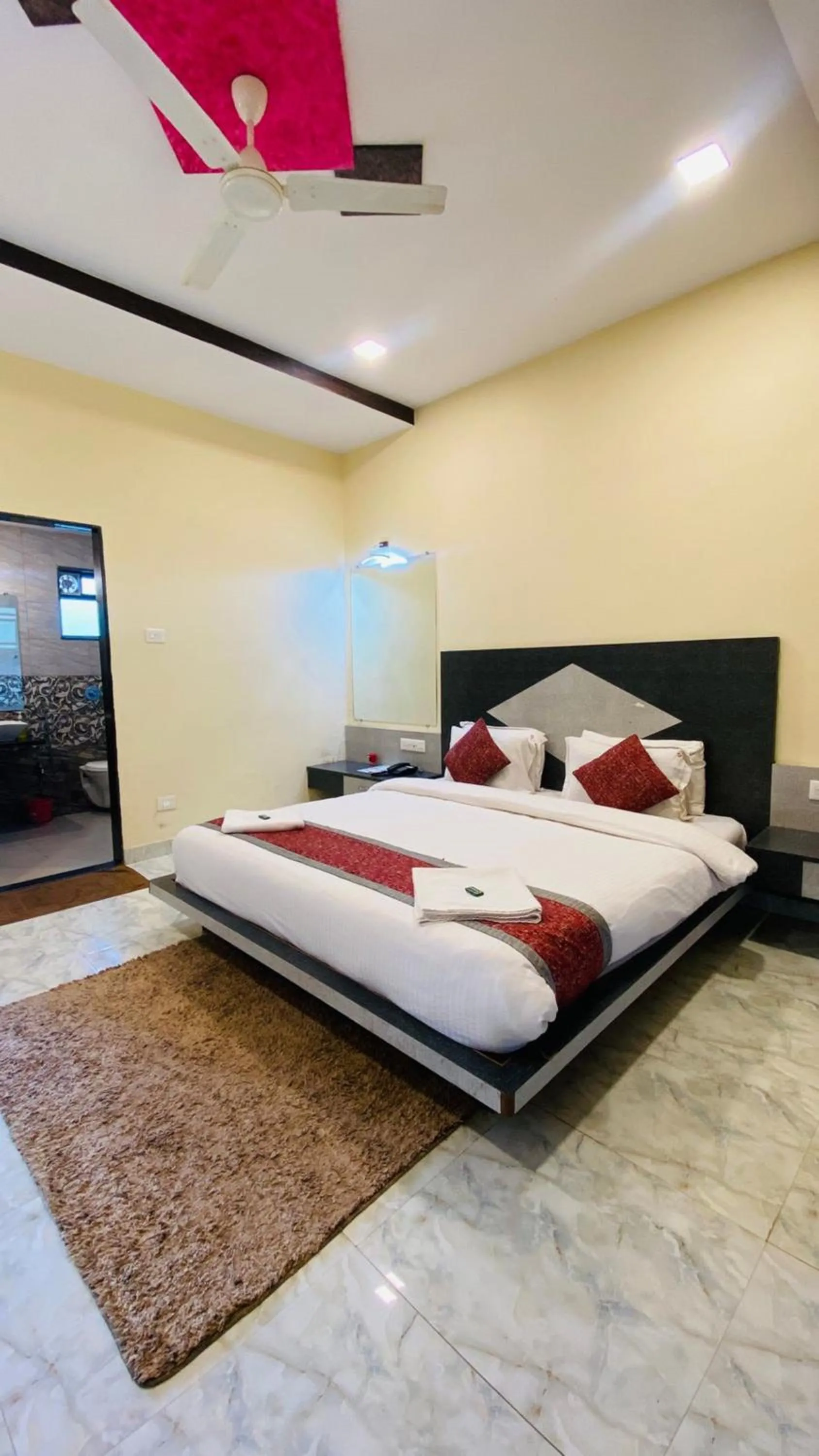 Bed in SHARDUL HERITAGE THE RESORT