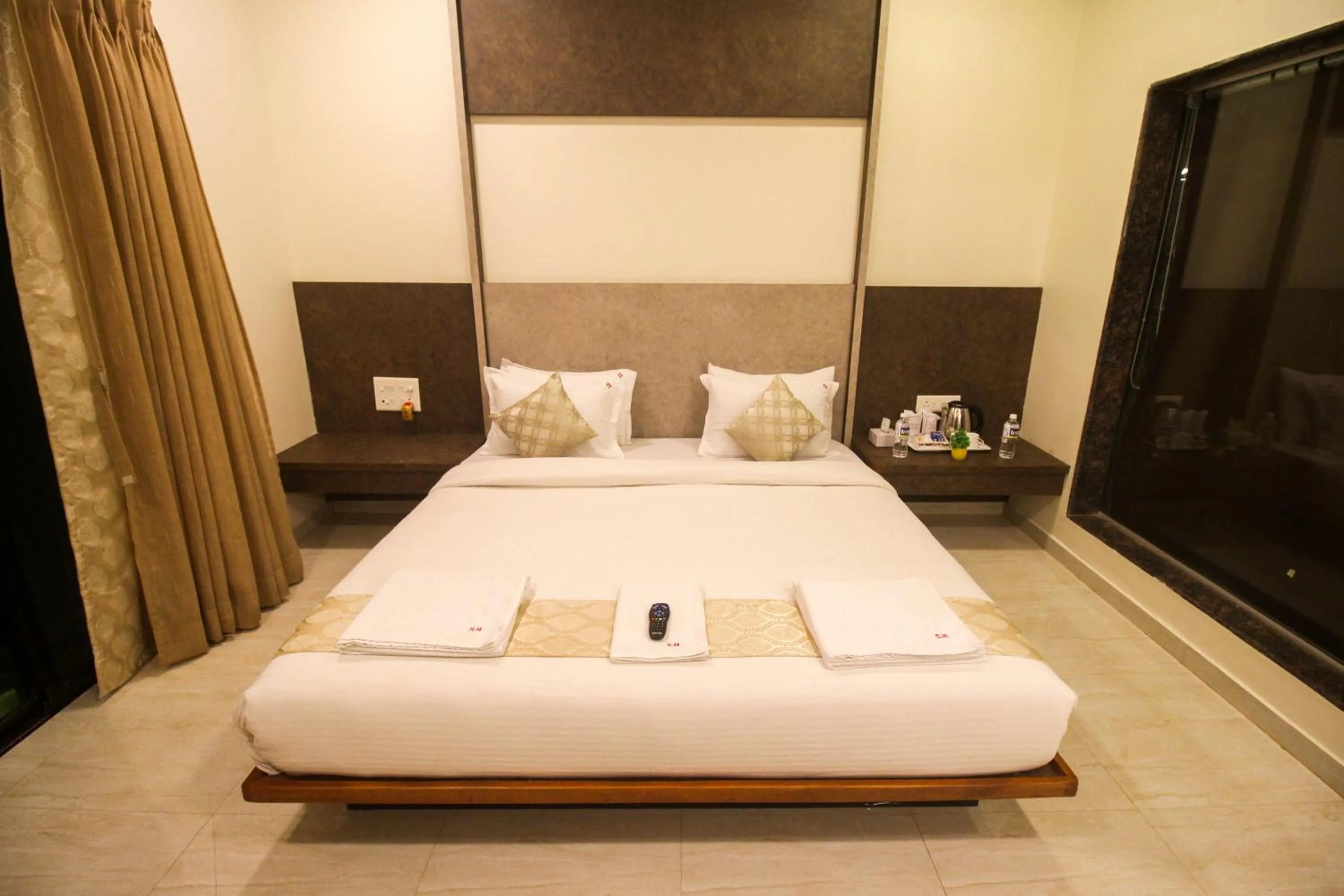 Bed in SHARDUL HERITAGE THE RESORT