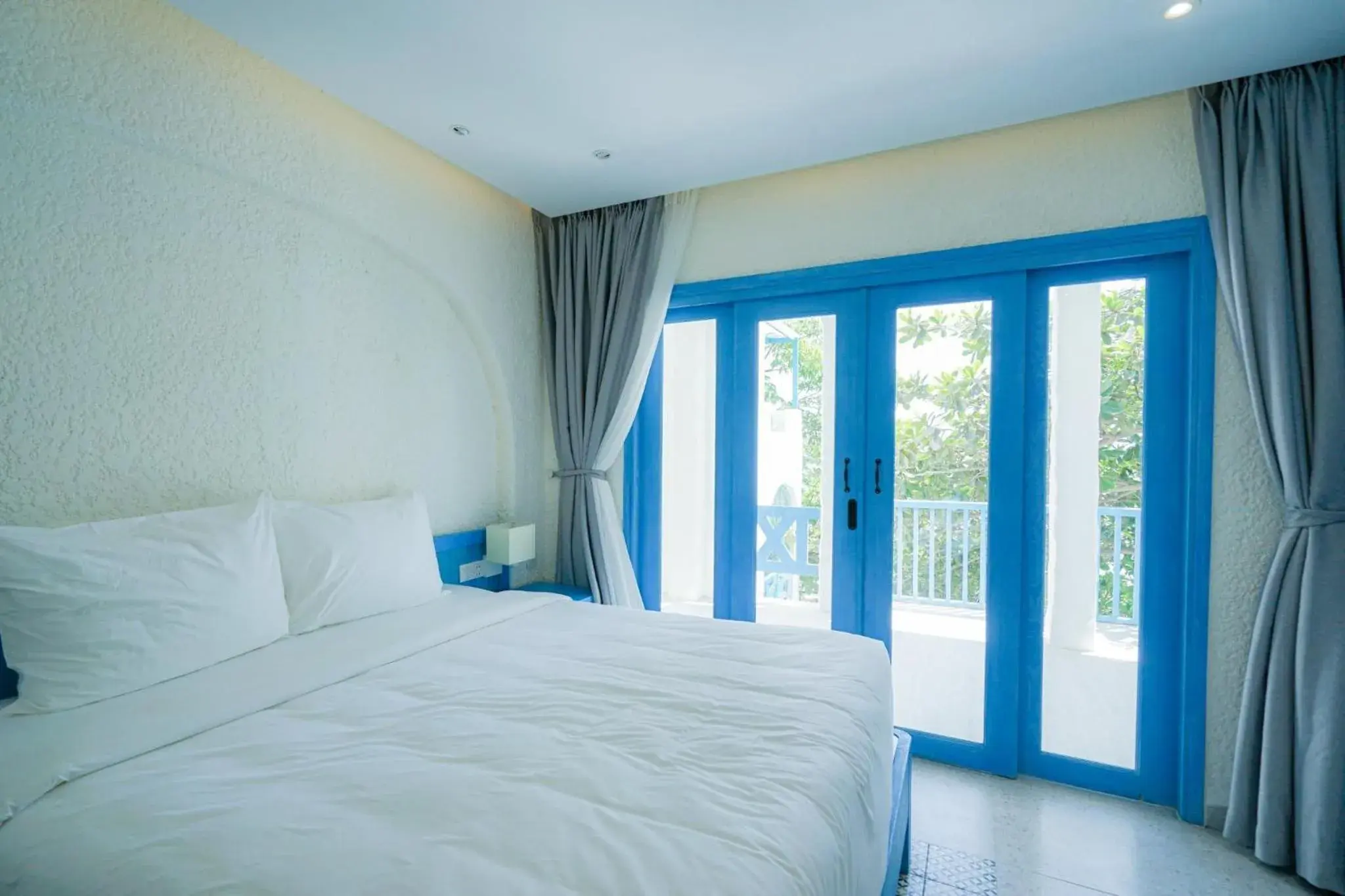 Bed in SUNTORINI BOUTIQUE HOTEL Bed in SUNTORINI BOUTIQUE HOTEL