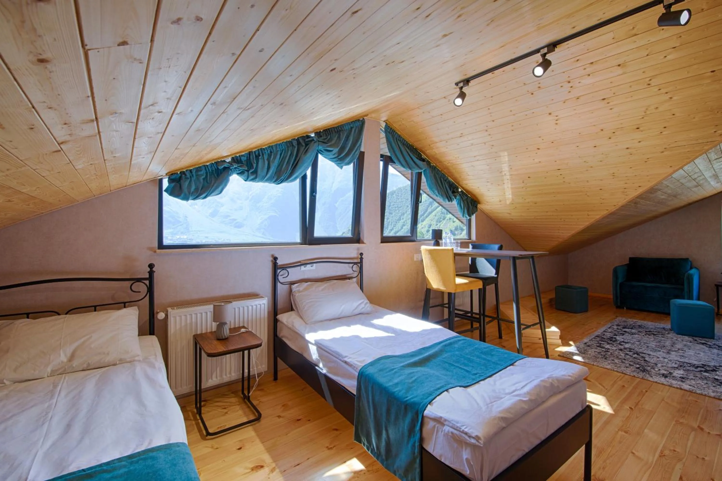 Bed in Hotel GENI Kazbegi