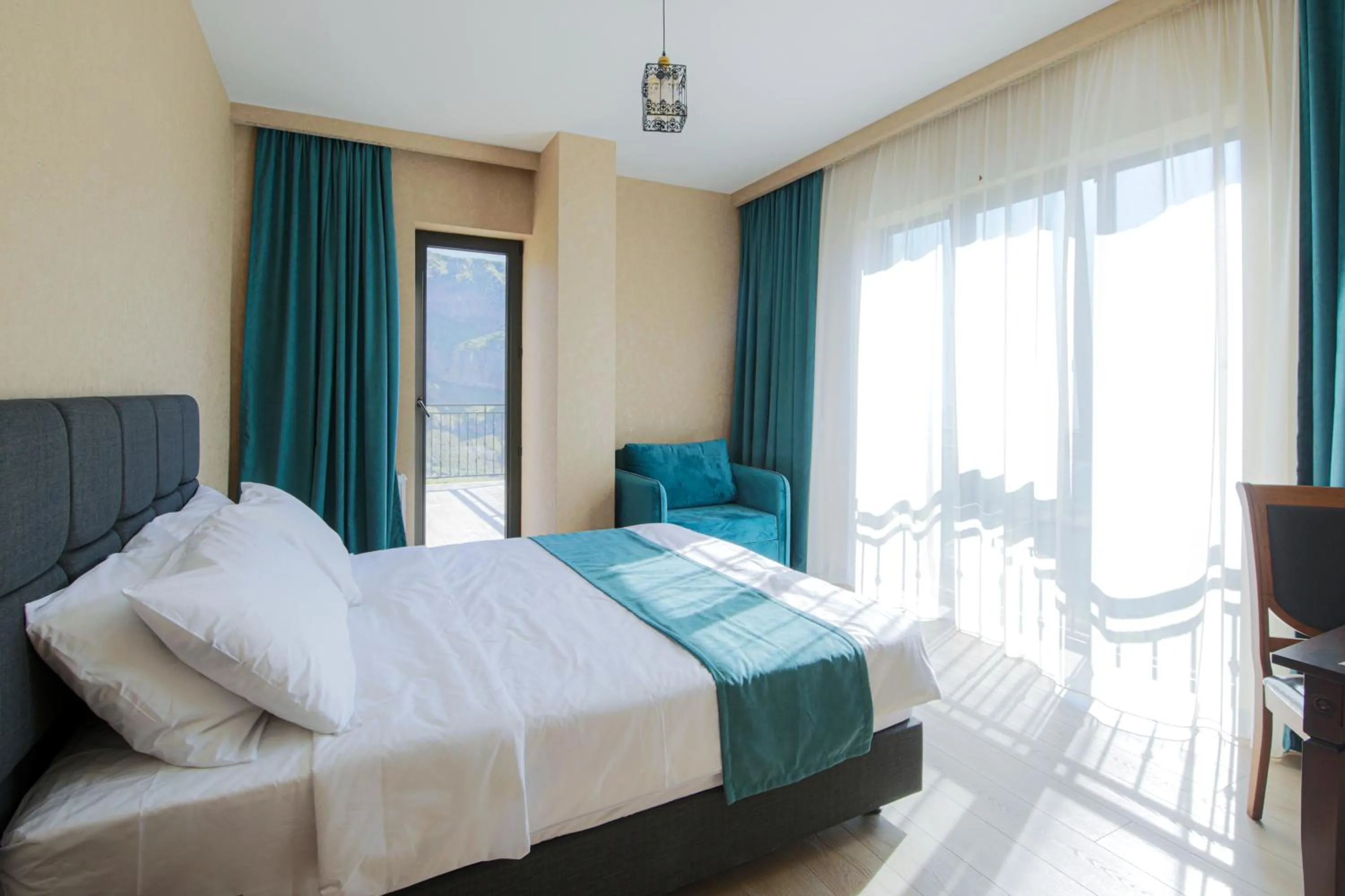 Bed in Hotel GENI Kazbegi