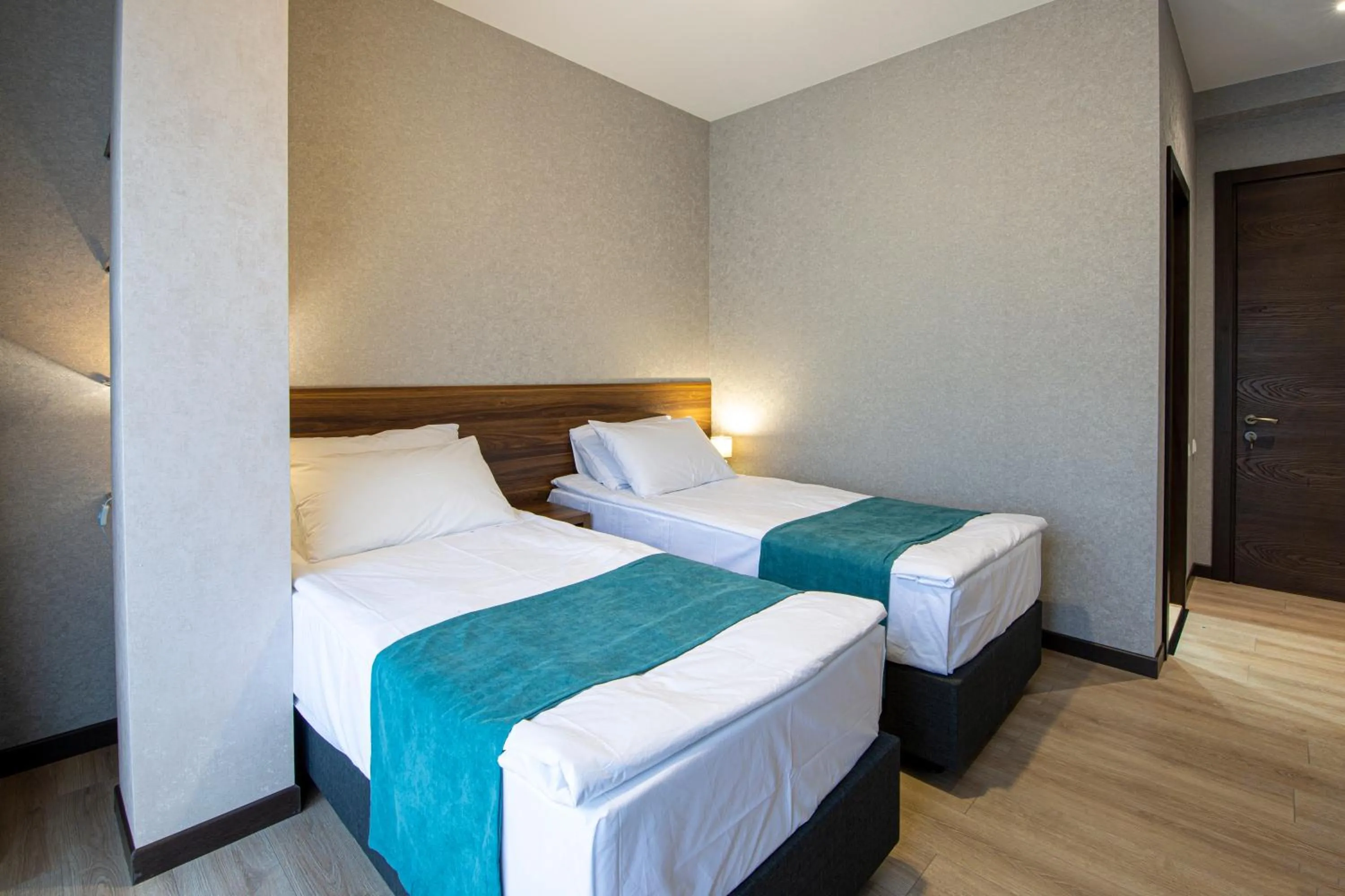 Bed in Hotel GENI Kazbegi