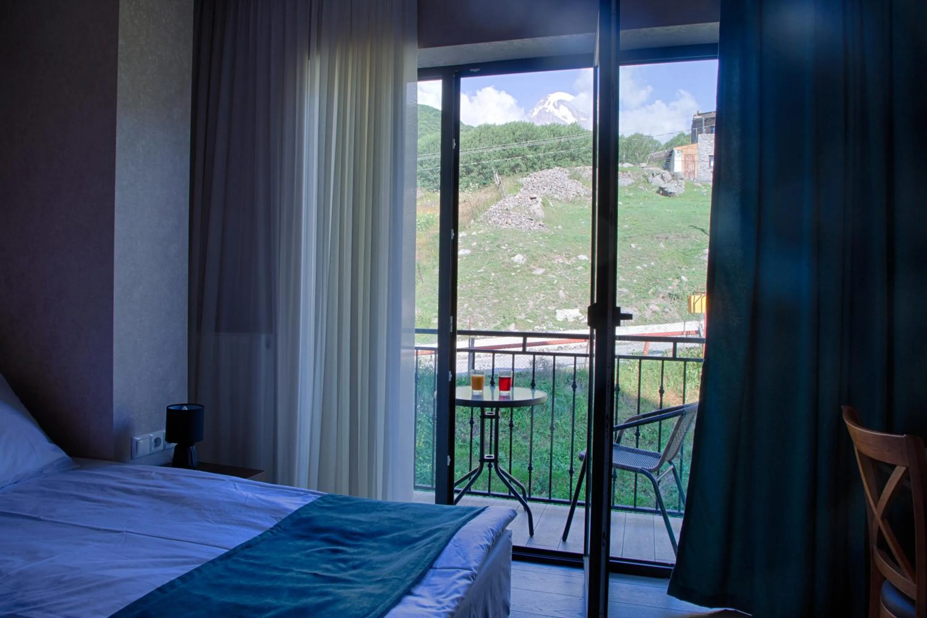 Balcony/Terrace, Bed in Hotel GENI Kazbegi