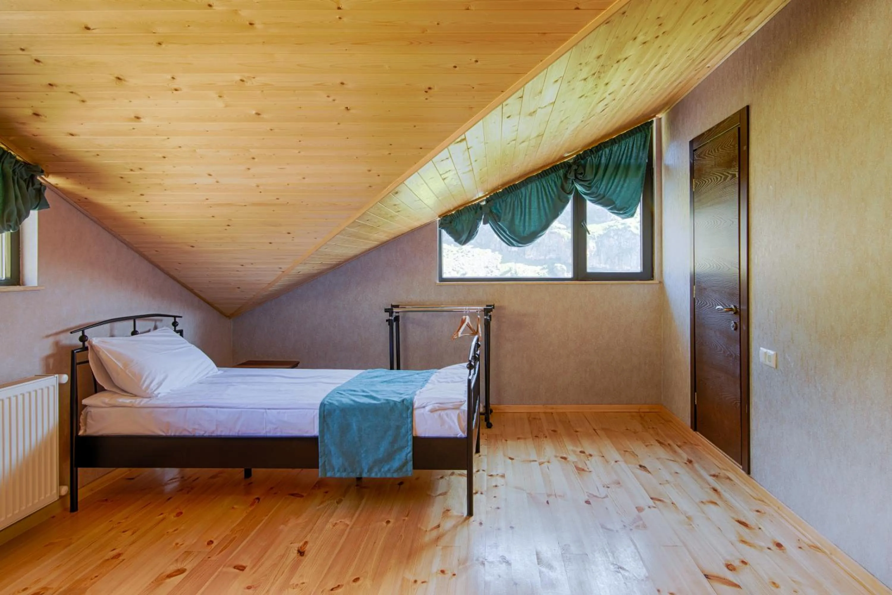 Bed in Hotel GENI Kazbegi