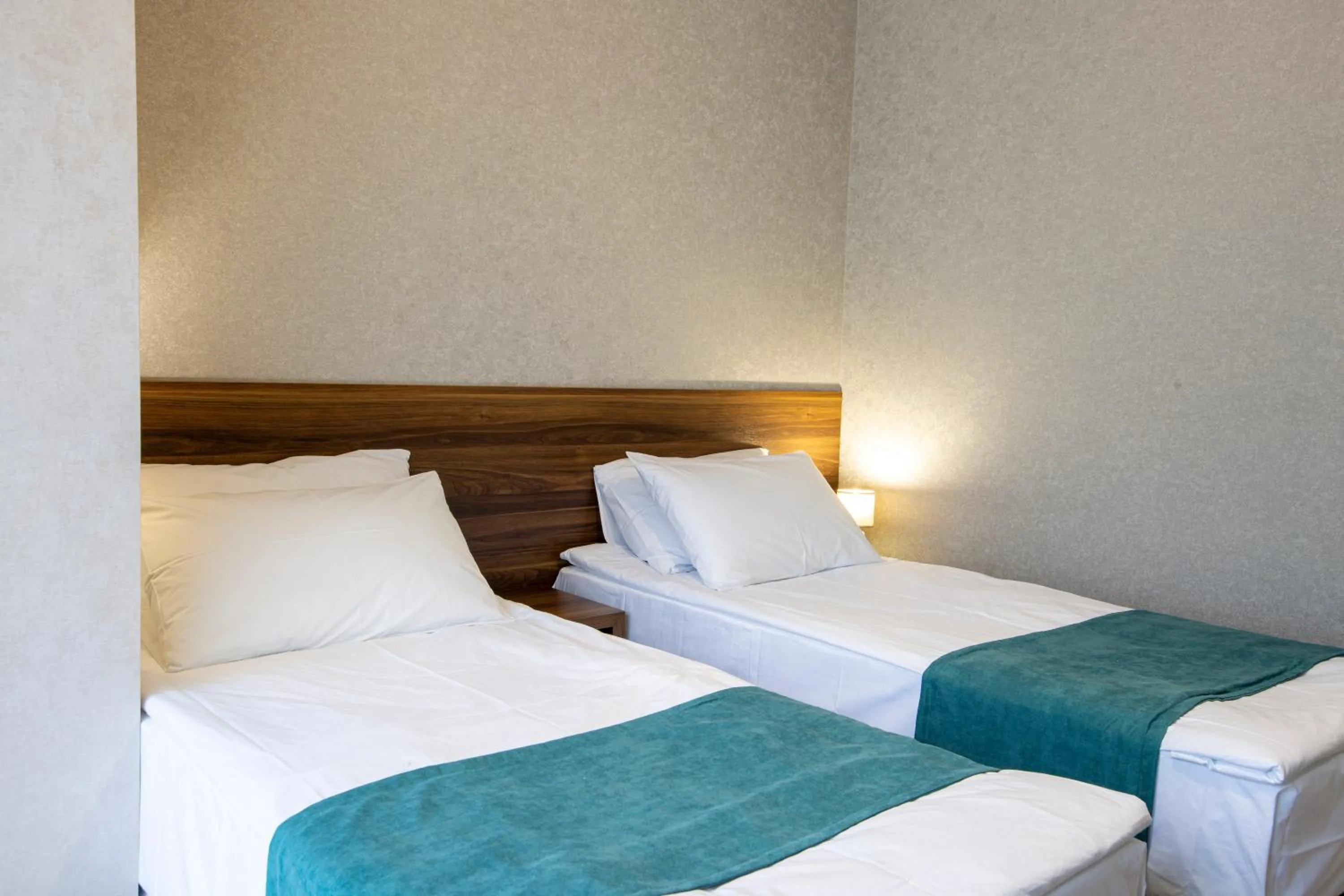 Bed in Hotel GENI Kazbegi