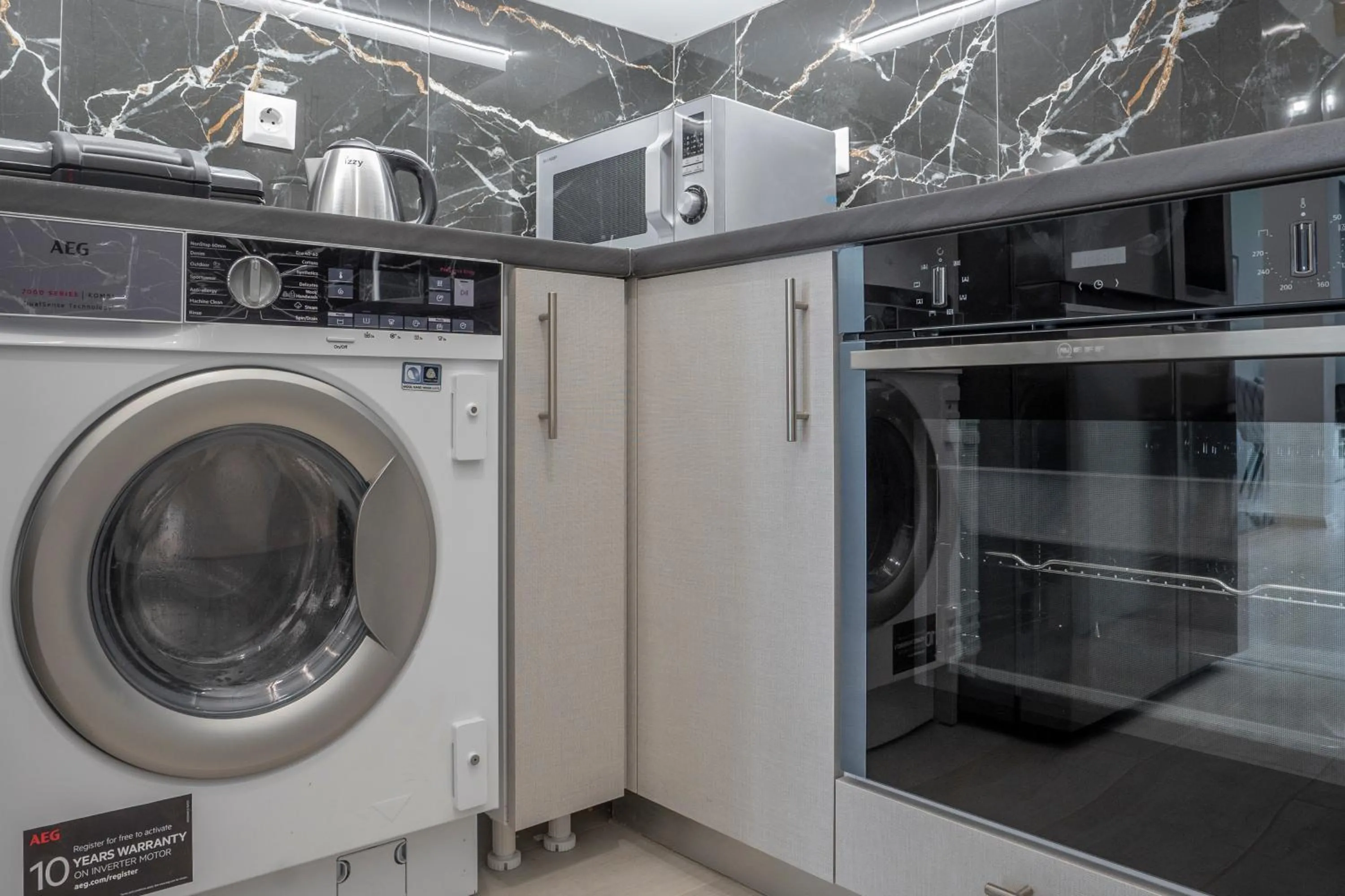 washing machine in 2 Bedroom condo with dream balcony