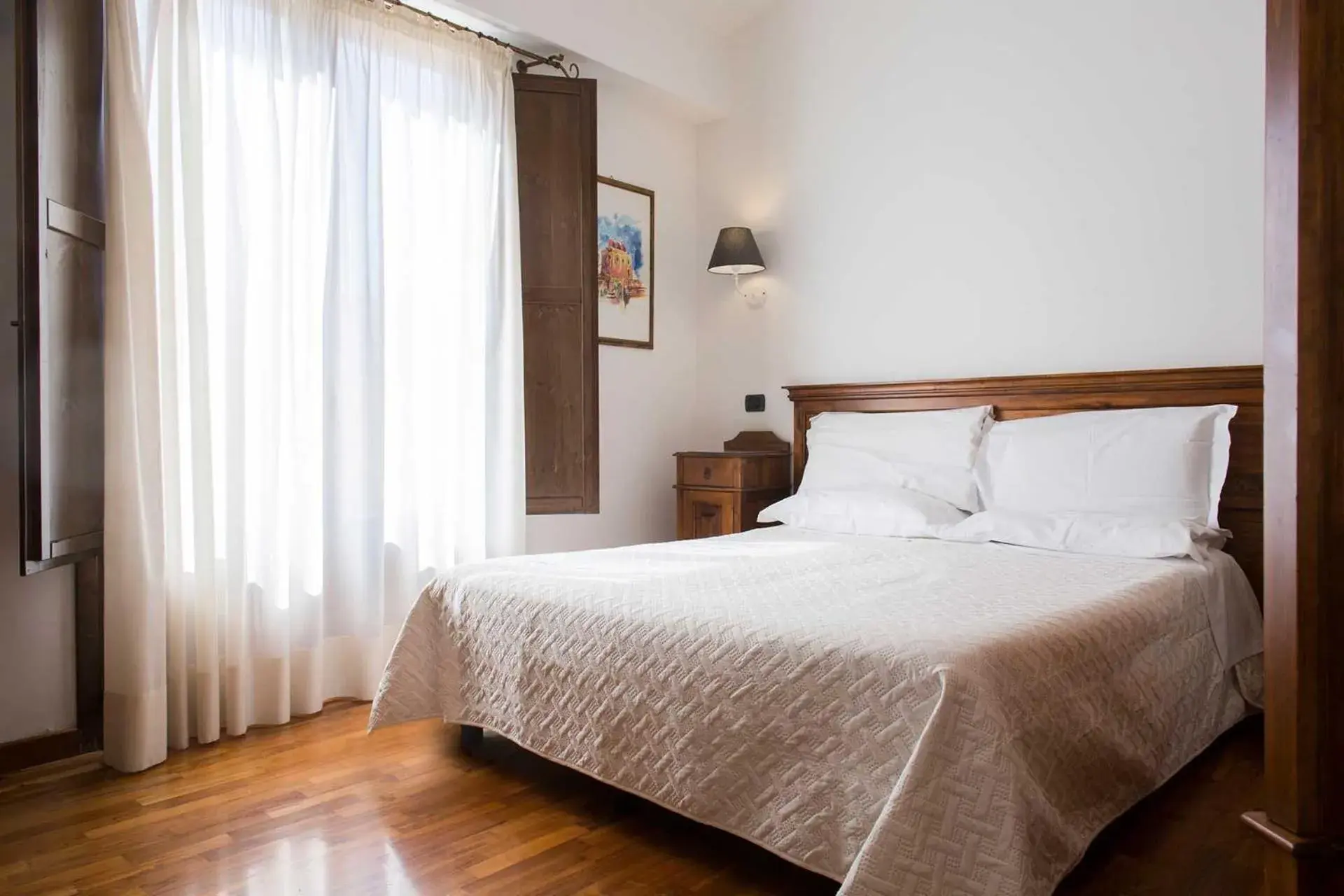 Photo of the whole room, Bed in Hotel La Piazzetta Photo of the whole room, Bed in Hotel La Piazzetta