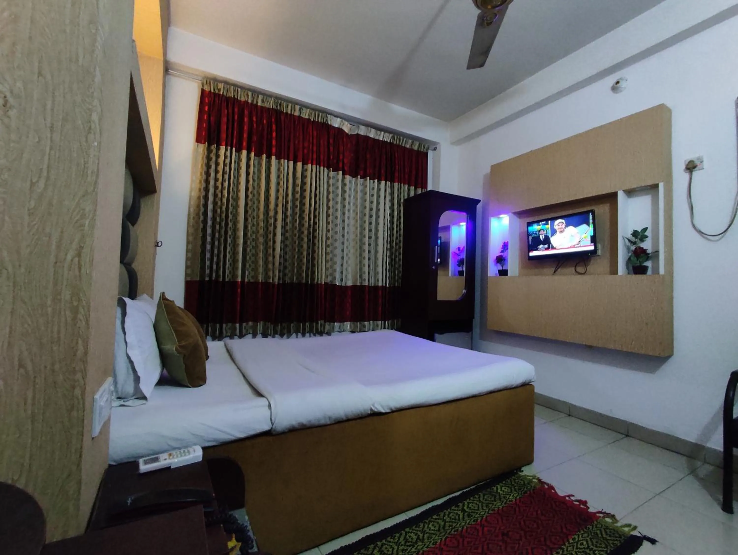 Bed in White Rose Suites Ltd