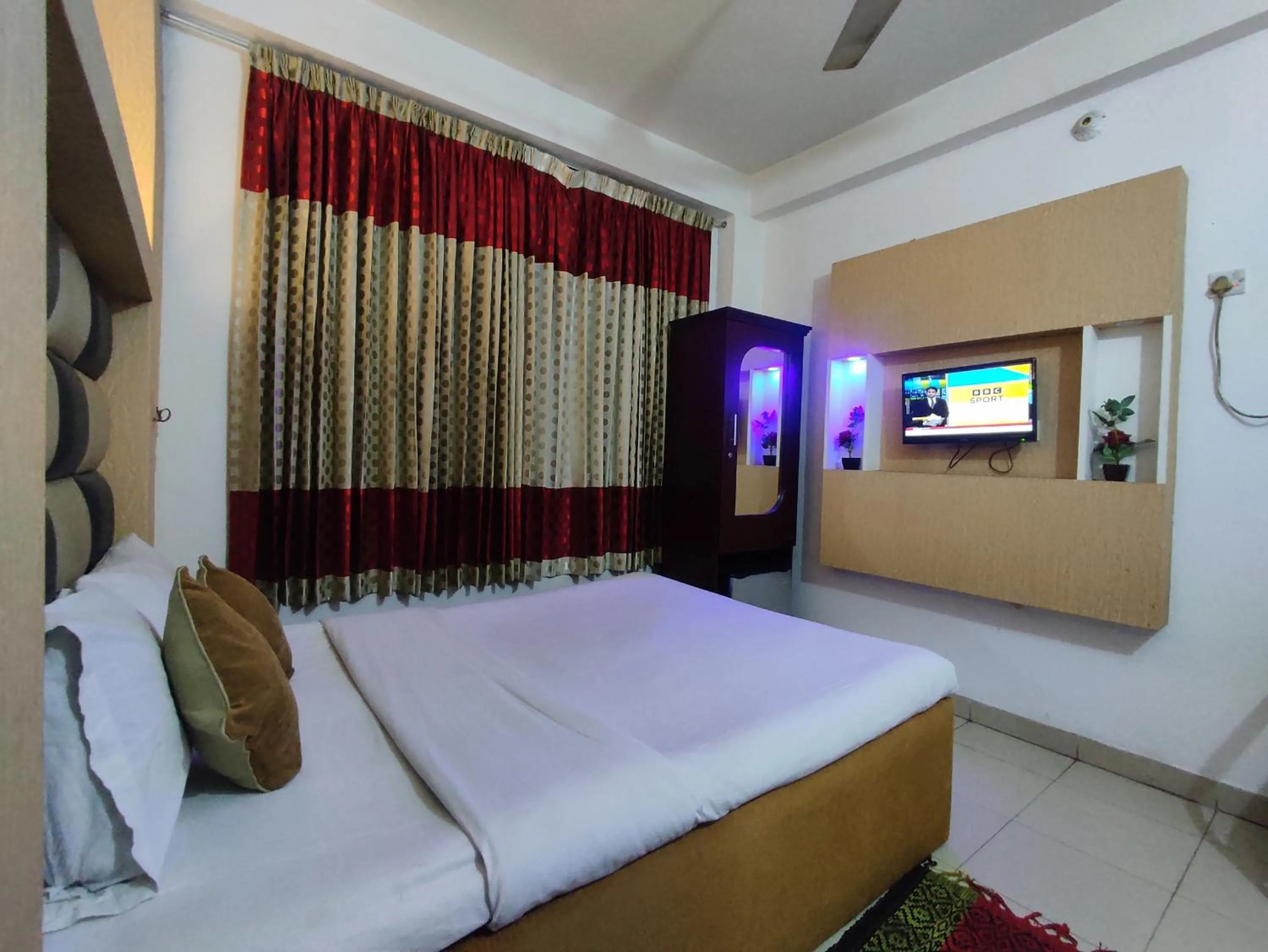 Bed in White Rose Suites Ltd