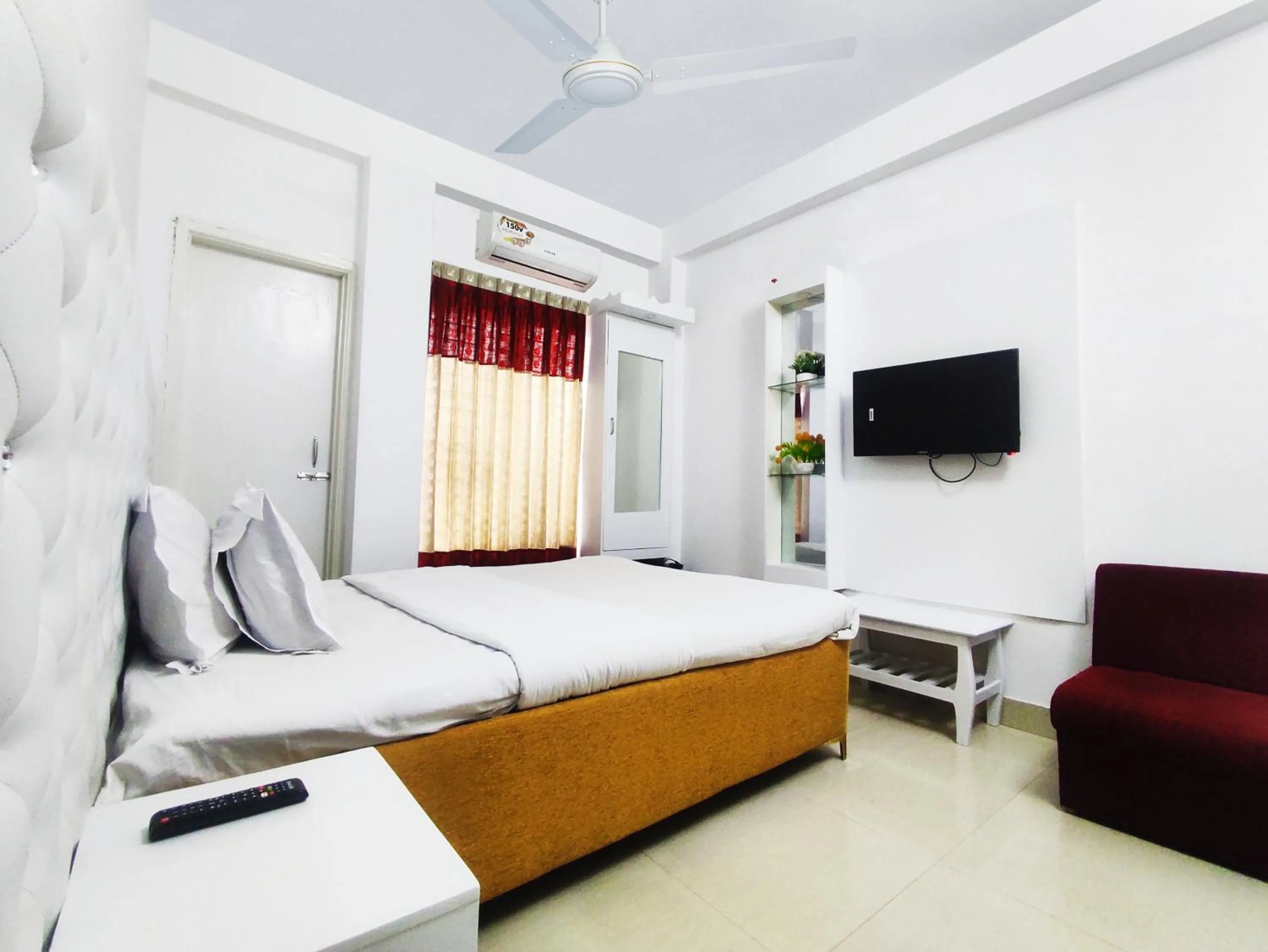 Bed in White Rose Suites Ltd