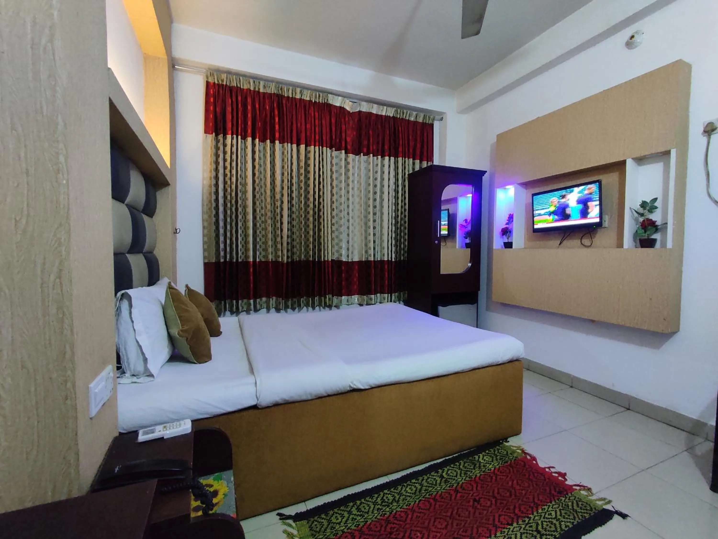 Bed in White Rose Suites Ltd