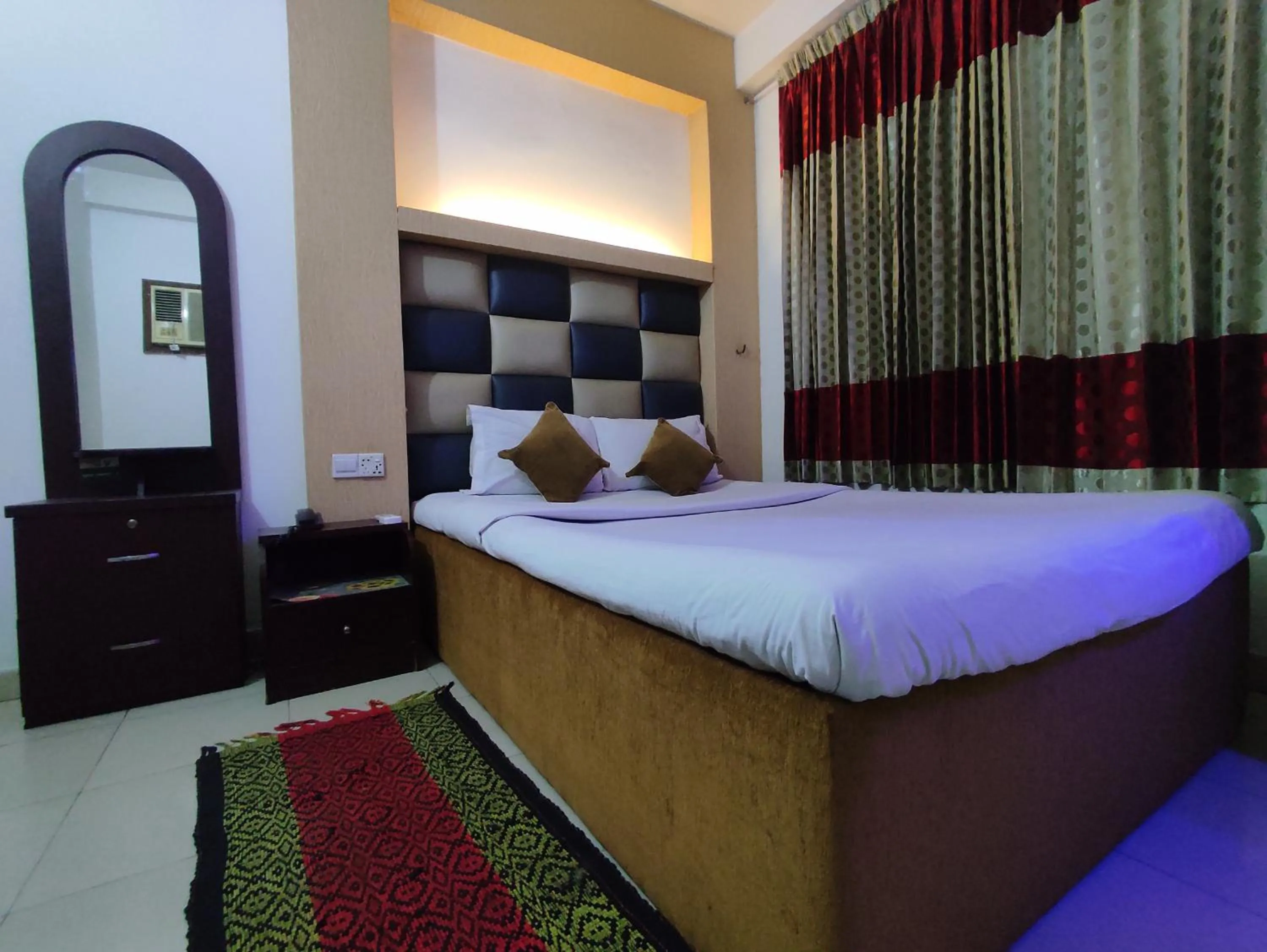 Bed in White Rose Suites Ltd
