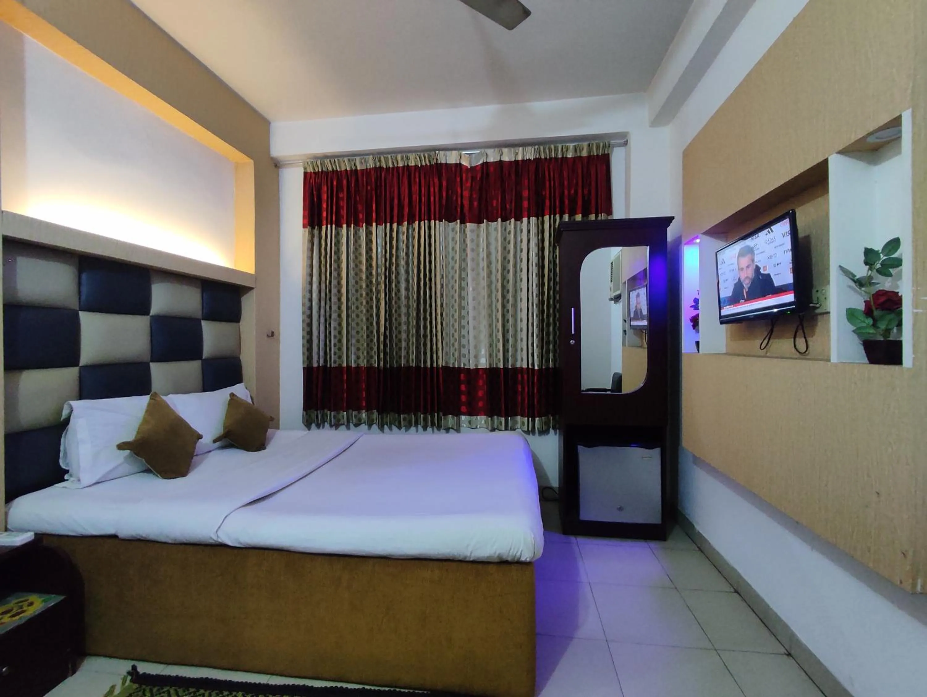 Bed in White Rose Suites Ltd