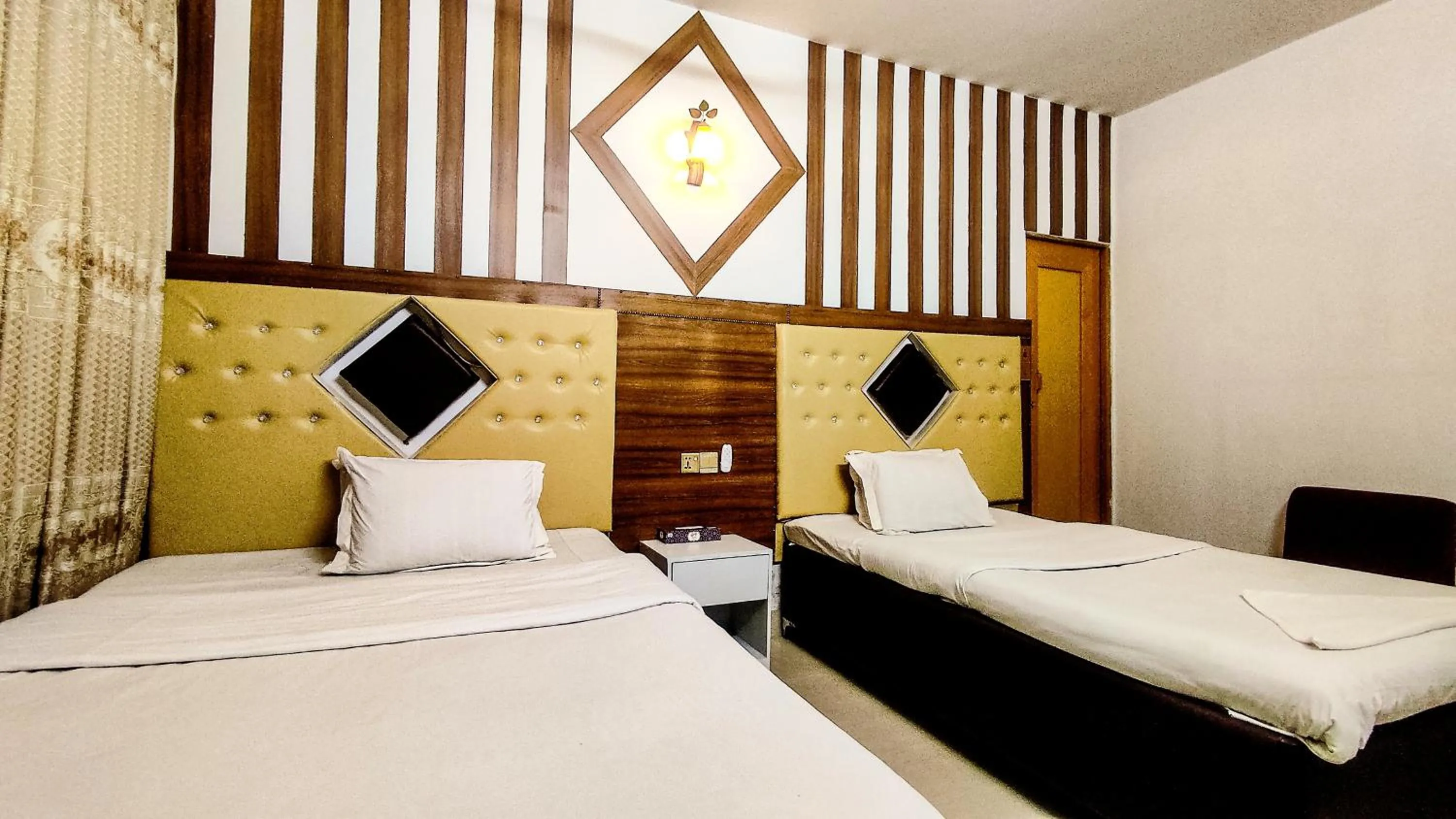 Bed in White Rose Suites Ltd
