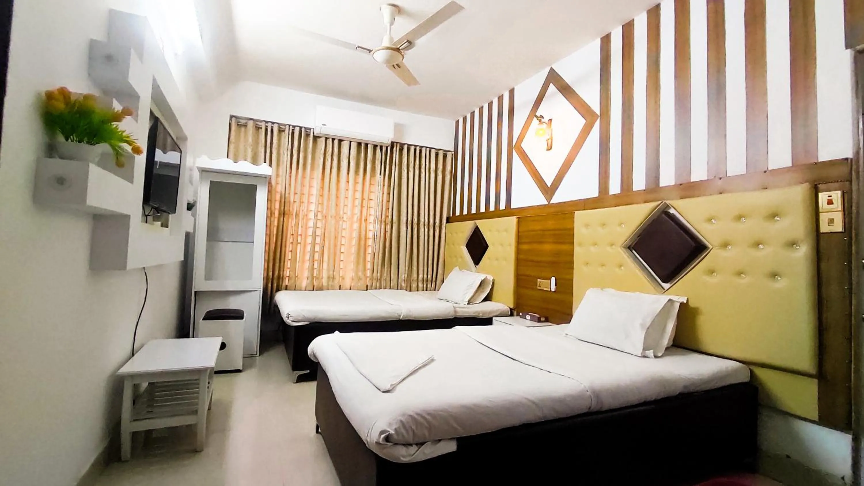 Bed in White Rose Suites Ltd