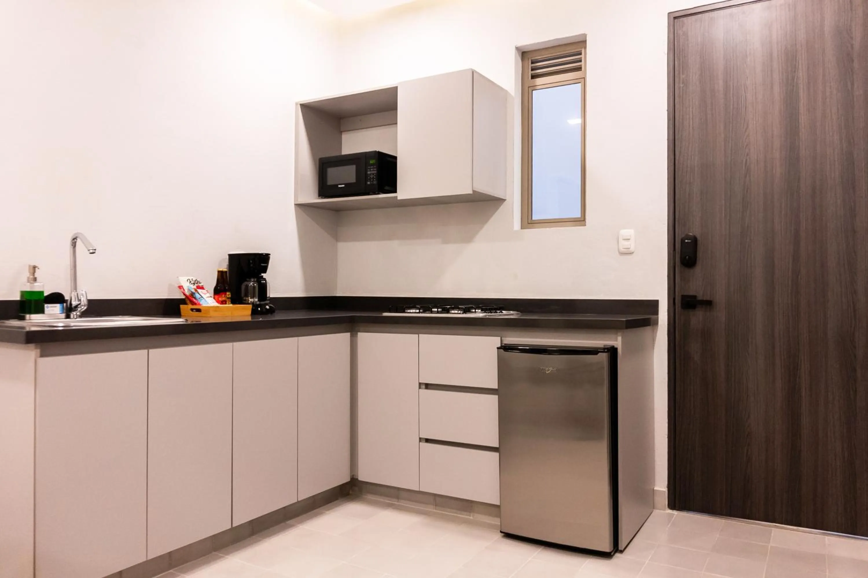 Kitchen or kitchenette in The Garden Suites