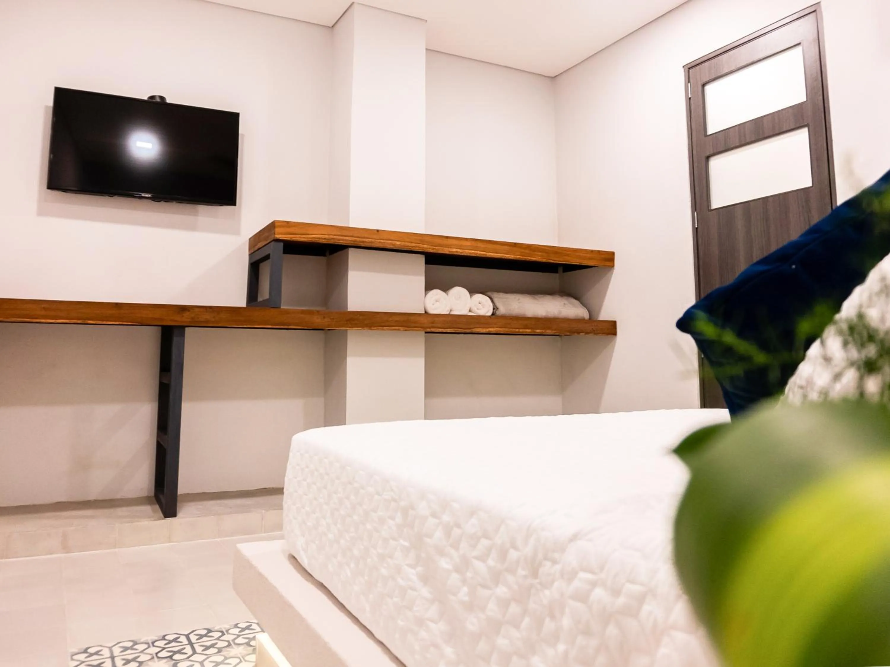 Bed in The Garden Suites