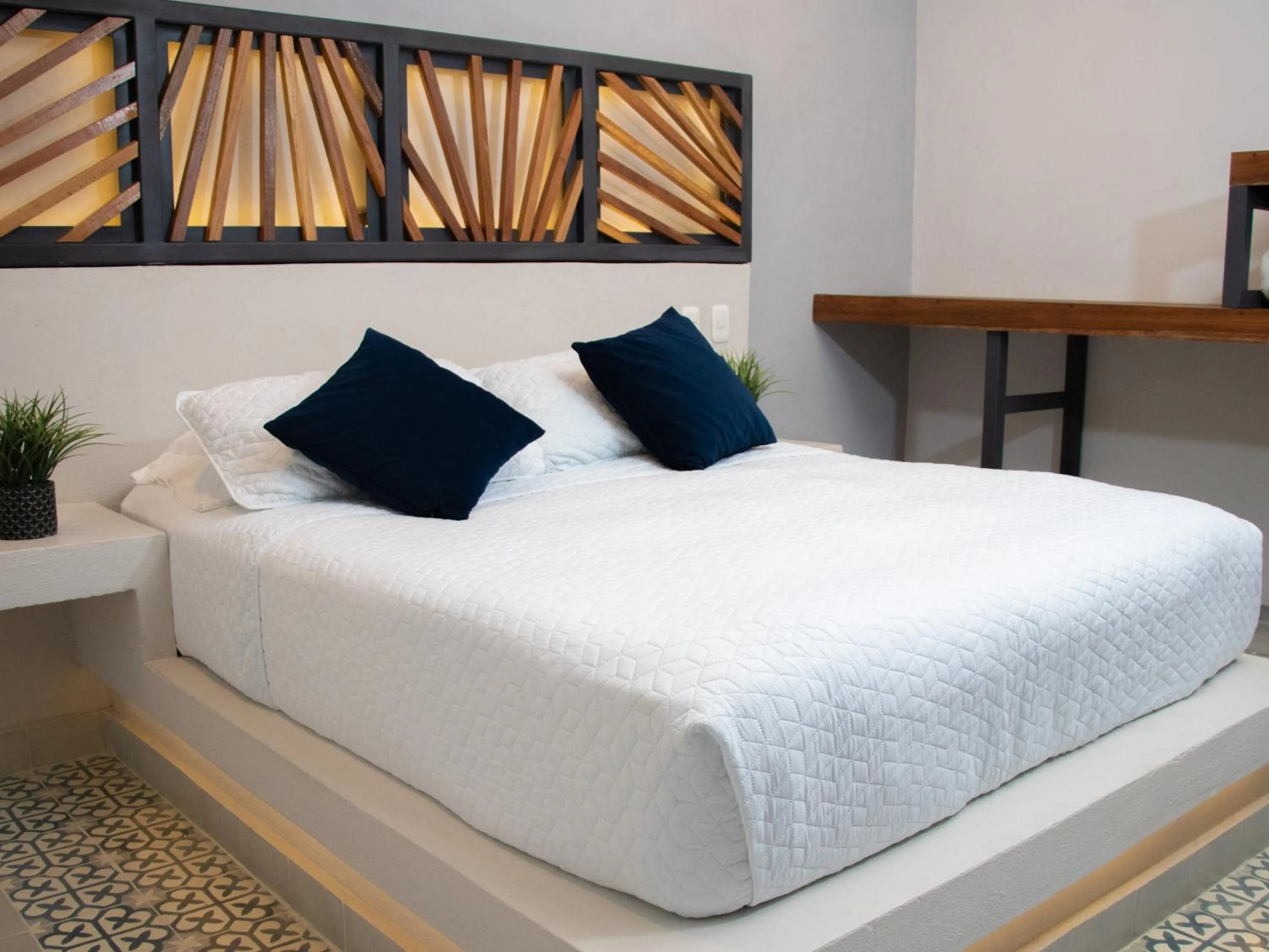 Bed in The Garden Suites