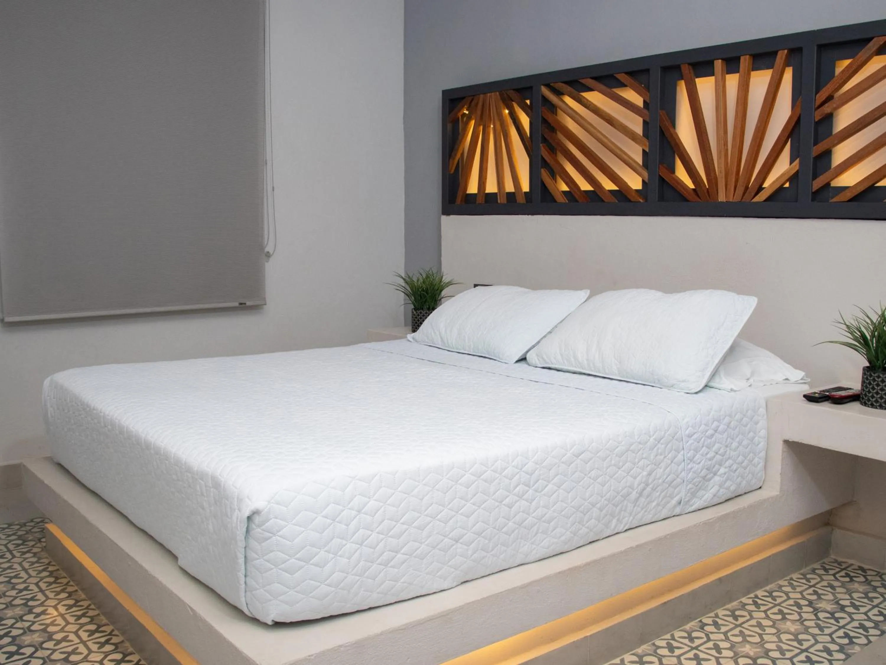 Bed in The Garden Suites