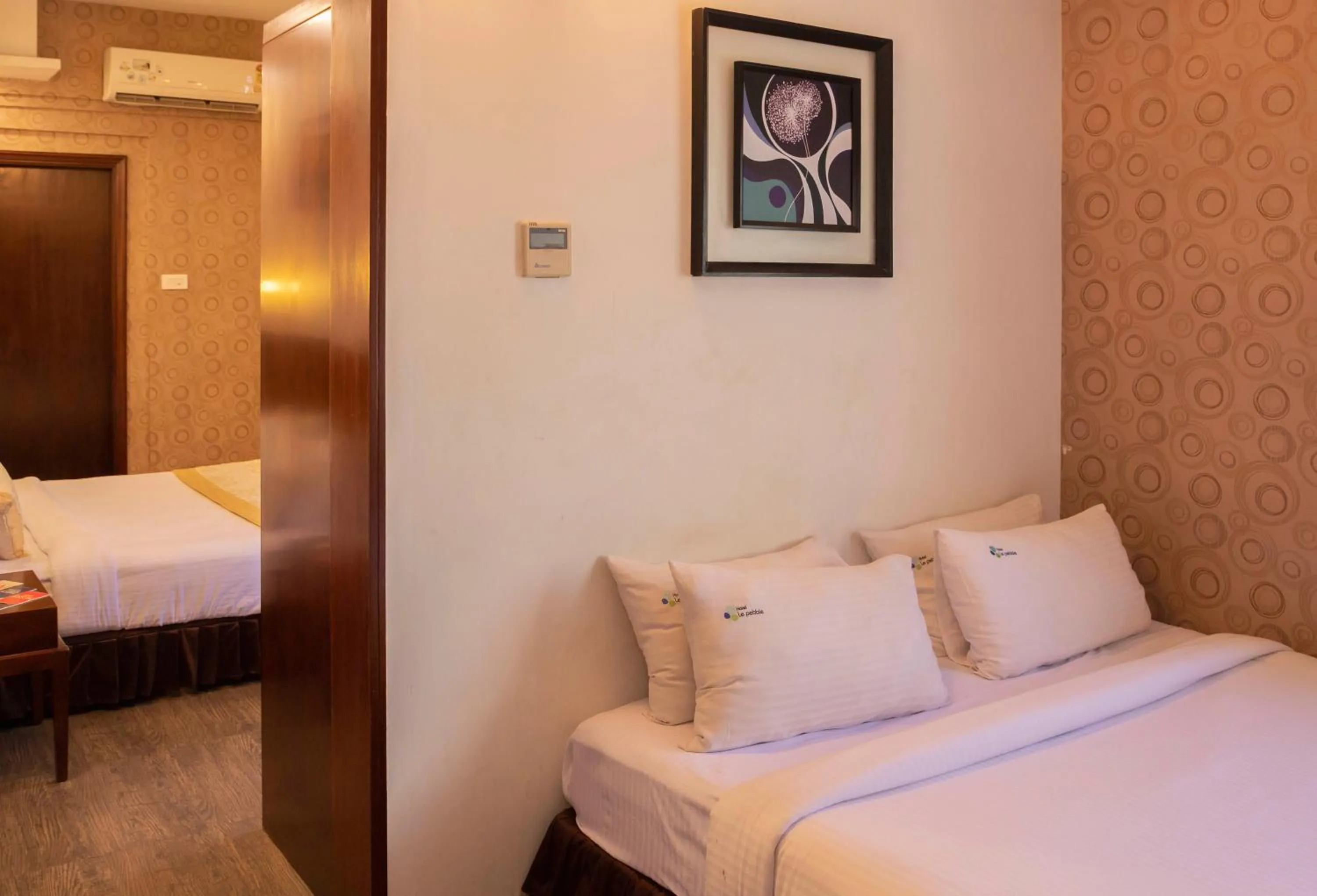 Bed in THE PEBBLE Boutique Hotel