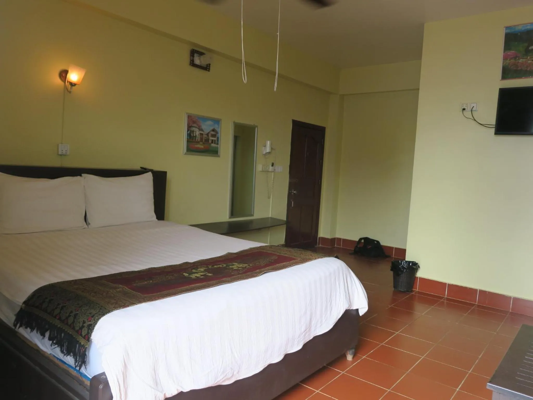 Bed in River Dolphin Hotel