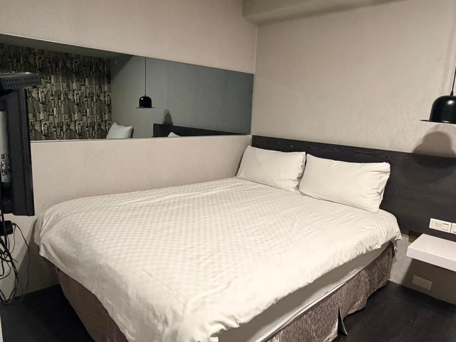 Bed in Main Inn Taipei