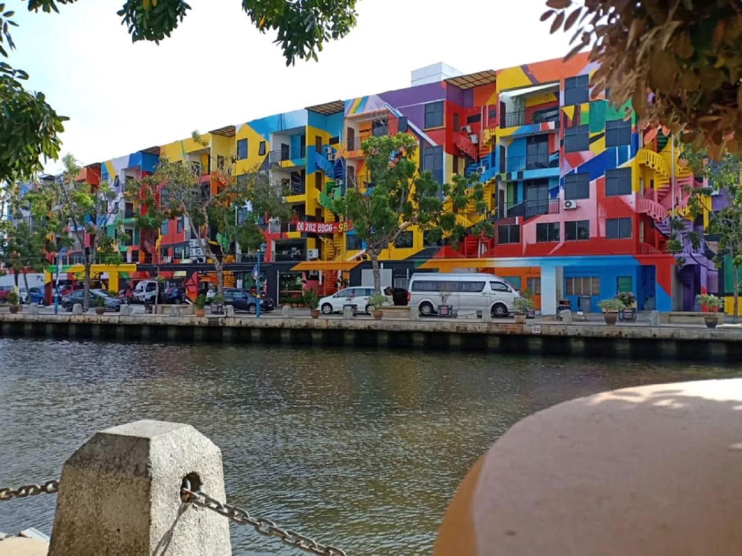 Text overlay in 906 Riverside Hotel Malacca