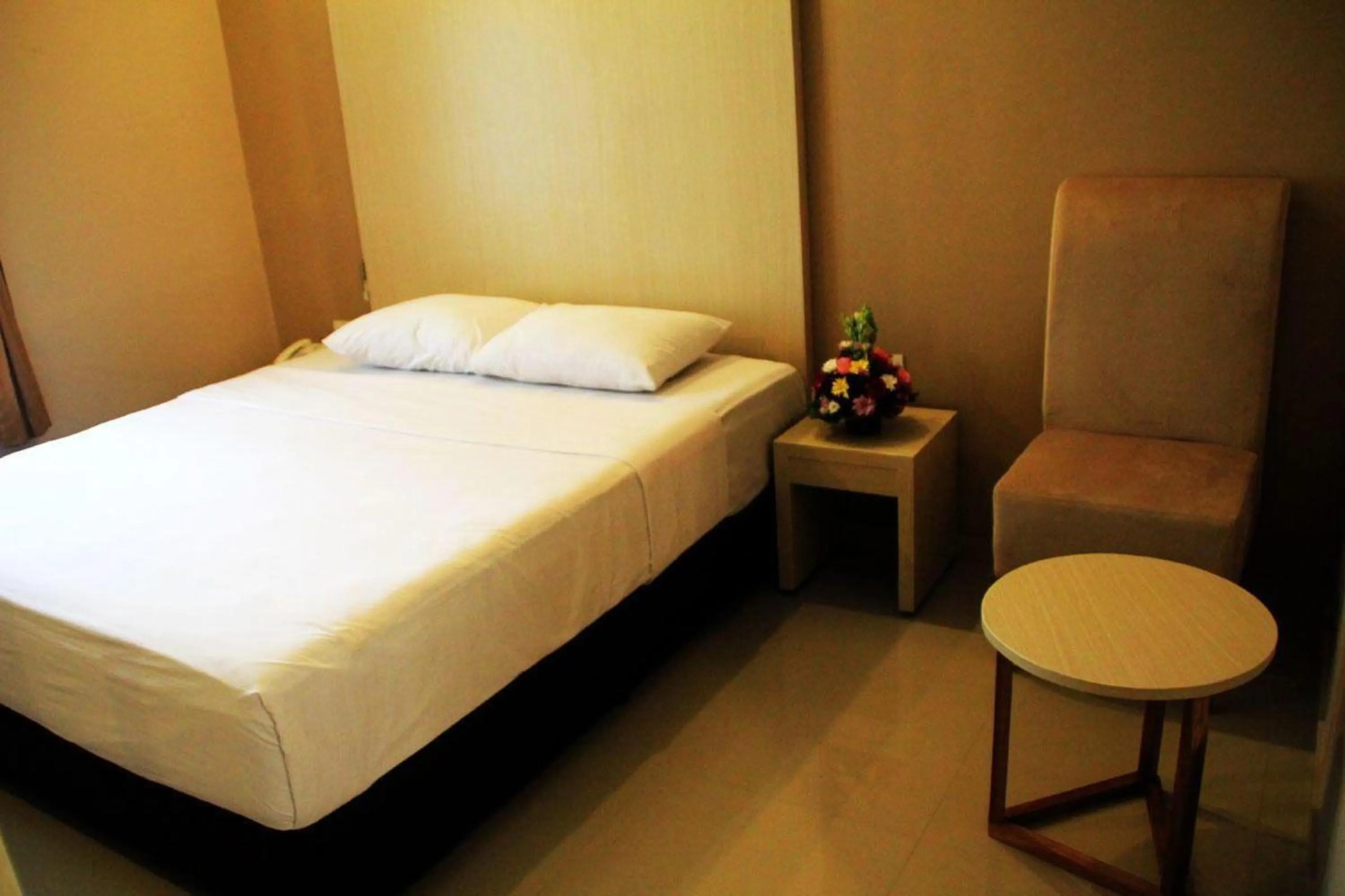 Photo of the whole room, Bed in Collection O Near Bajra Sandi Monumen Formerly Grand Pondok Puri Ayu