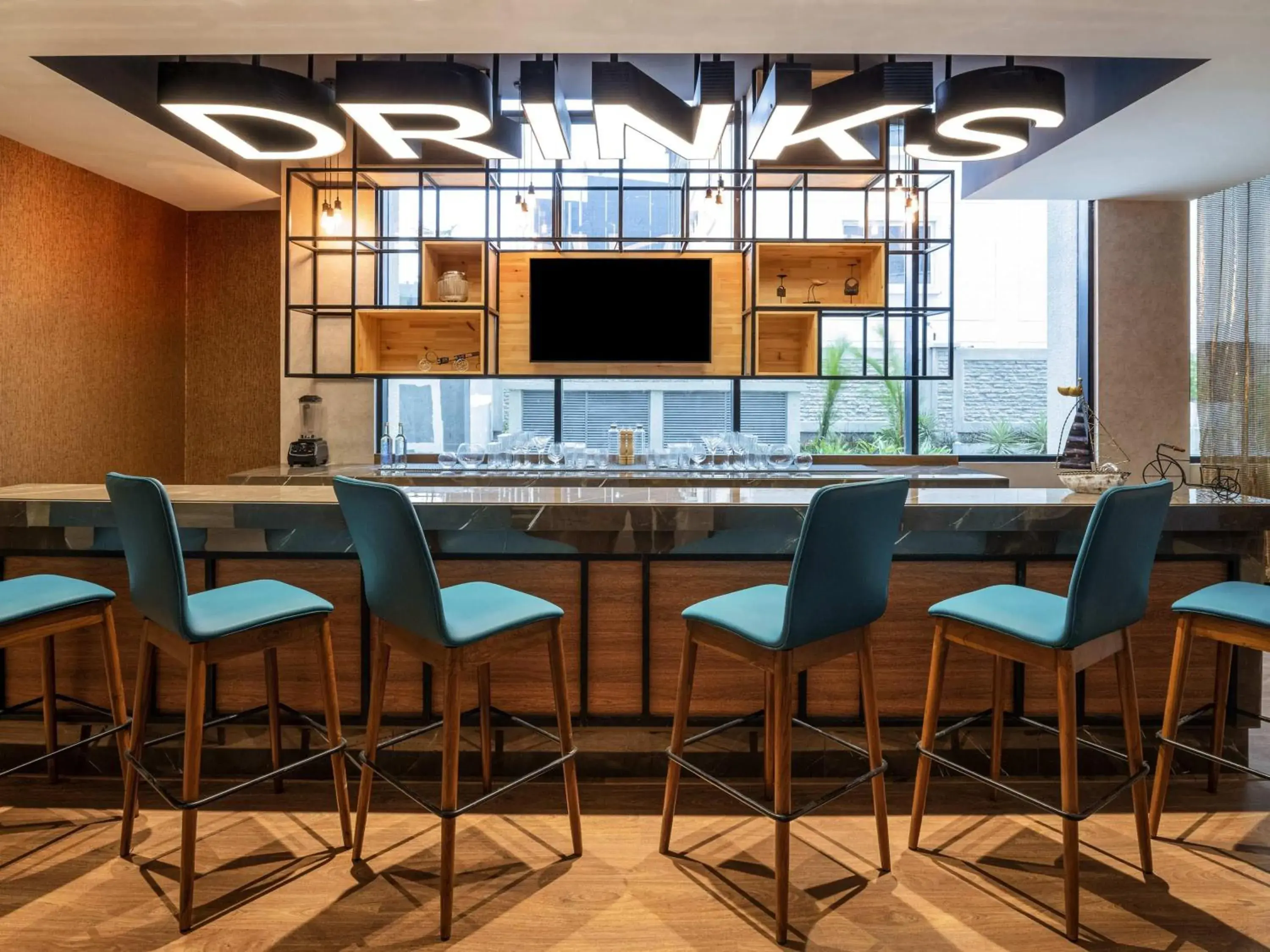 Lounge or bar in ibis Bengaluru Hebbal - An Accor Brand Lounge or bar in ibis Bengaluru Hebbal - An Accor Brand