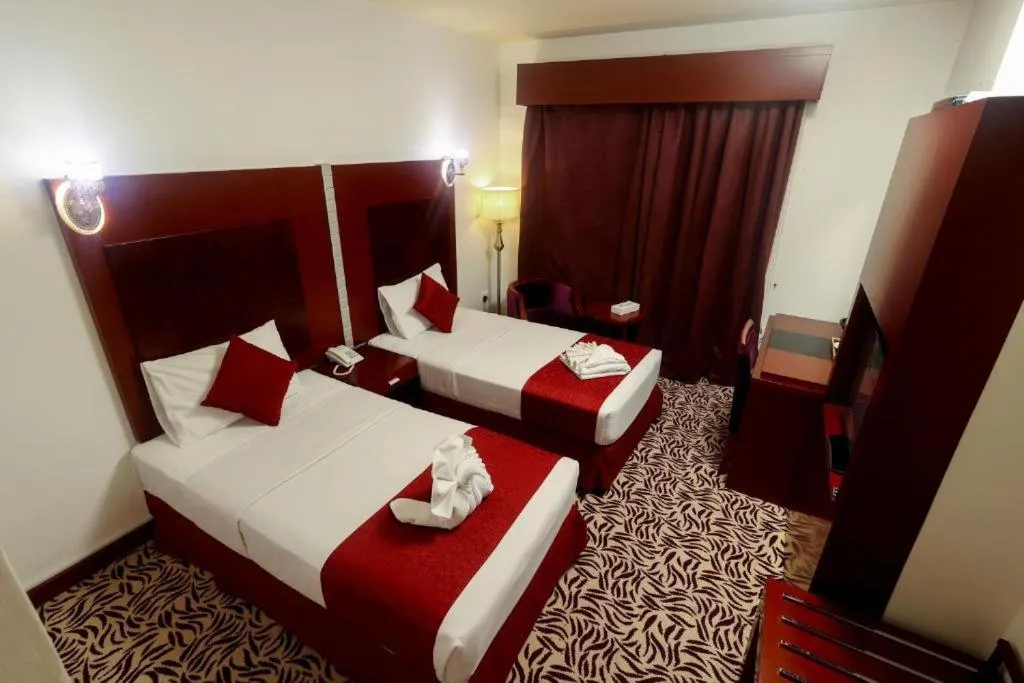 Bed in MRA Grand Hotel