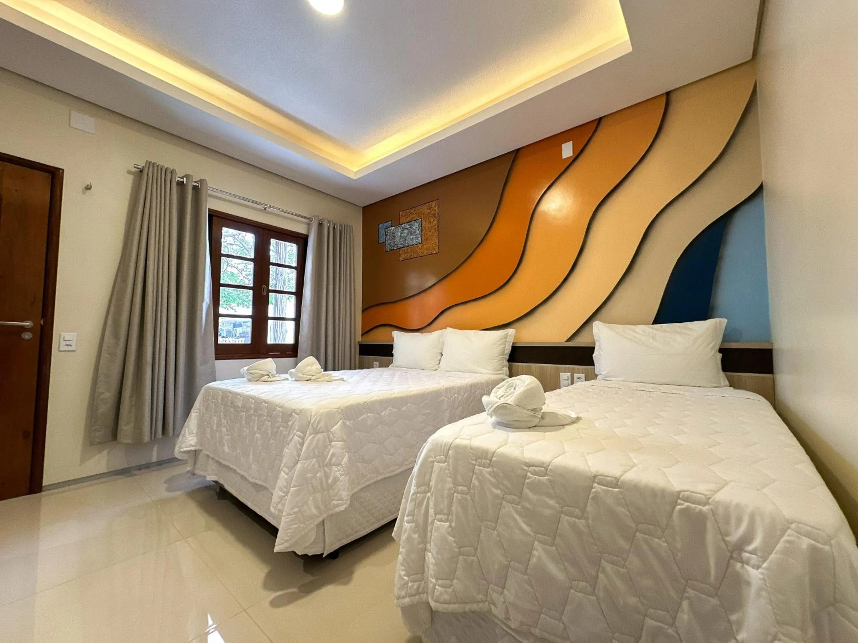 Bed in Pousada Lençóis Maranhenses