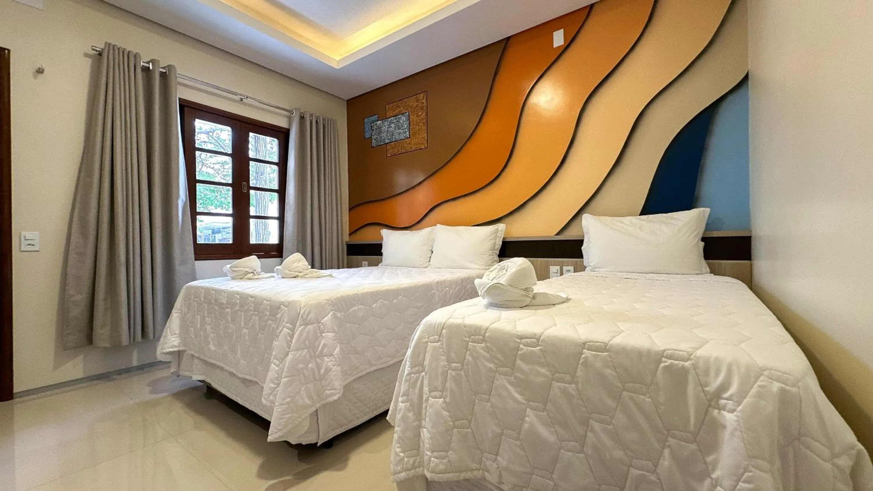 Bed in Pousada Lençóis Maranhenses