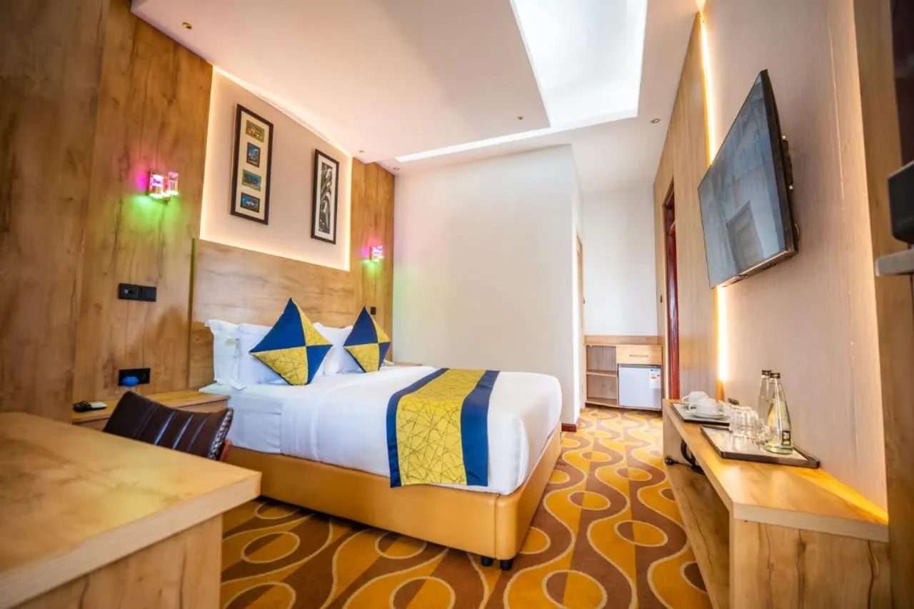 Bed in Afro Park Hotel